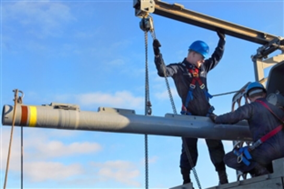 U.S. Navy Petty Officer 2nd Class Andy Friedric loads the rolling airframe missile system aboard assault ship USS Essex, under way in the Pacific Ocean, Jan. 30, 2009. The rolling system is used for supersonic, short-range missile defense.