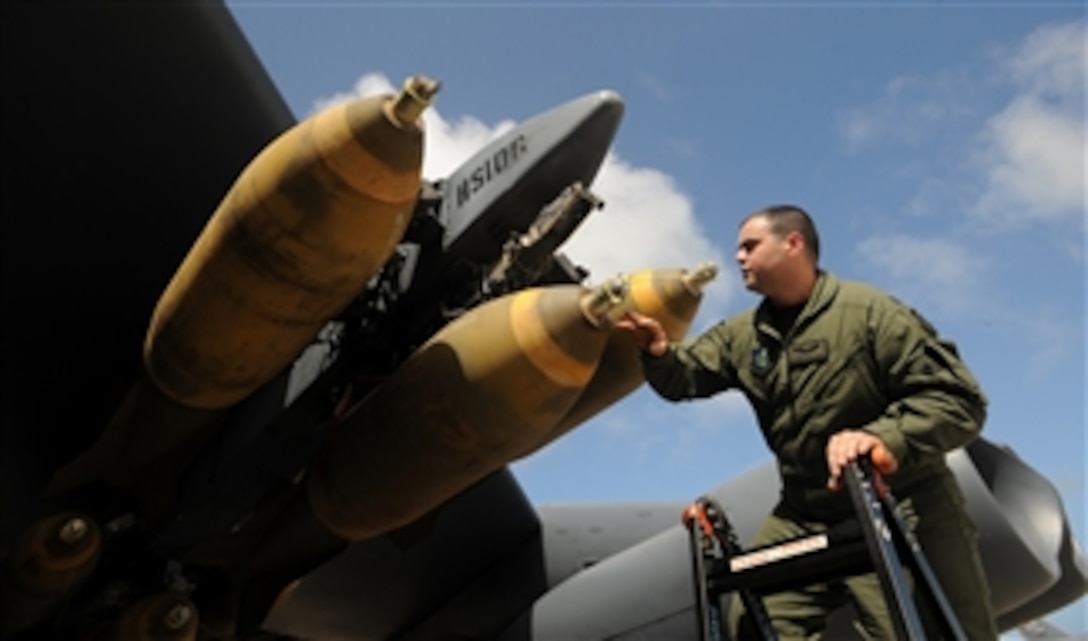 Capt. Patrick Applegate of the 23rd Expeditionary Bomb Squadron removes ground safety pins on a MAU-12 prior to a B-52 Stratofortress live drop mission for exercise Tropic Fury over the Farallon de Medinilla Target Range on Jan. 29, 2009.  The B-52 will also drop live M-117 ordnance during the exercise.  Tropic Fury was developed to train aircrew on the use of conventional air launched crew missiles and joint air-to-surface standoff missile conventional weapon systems.  The B-52 is deployed from Minot Air Force Base, N.D., to Andersen Air Force Base, Guam, 23rd Expeditionary Bomb Squadron.  Training missions such as this one ensures that maintenance and aircrews both perform real world tactics and defensive measures by loading and dropping live weapons on target.  