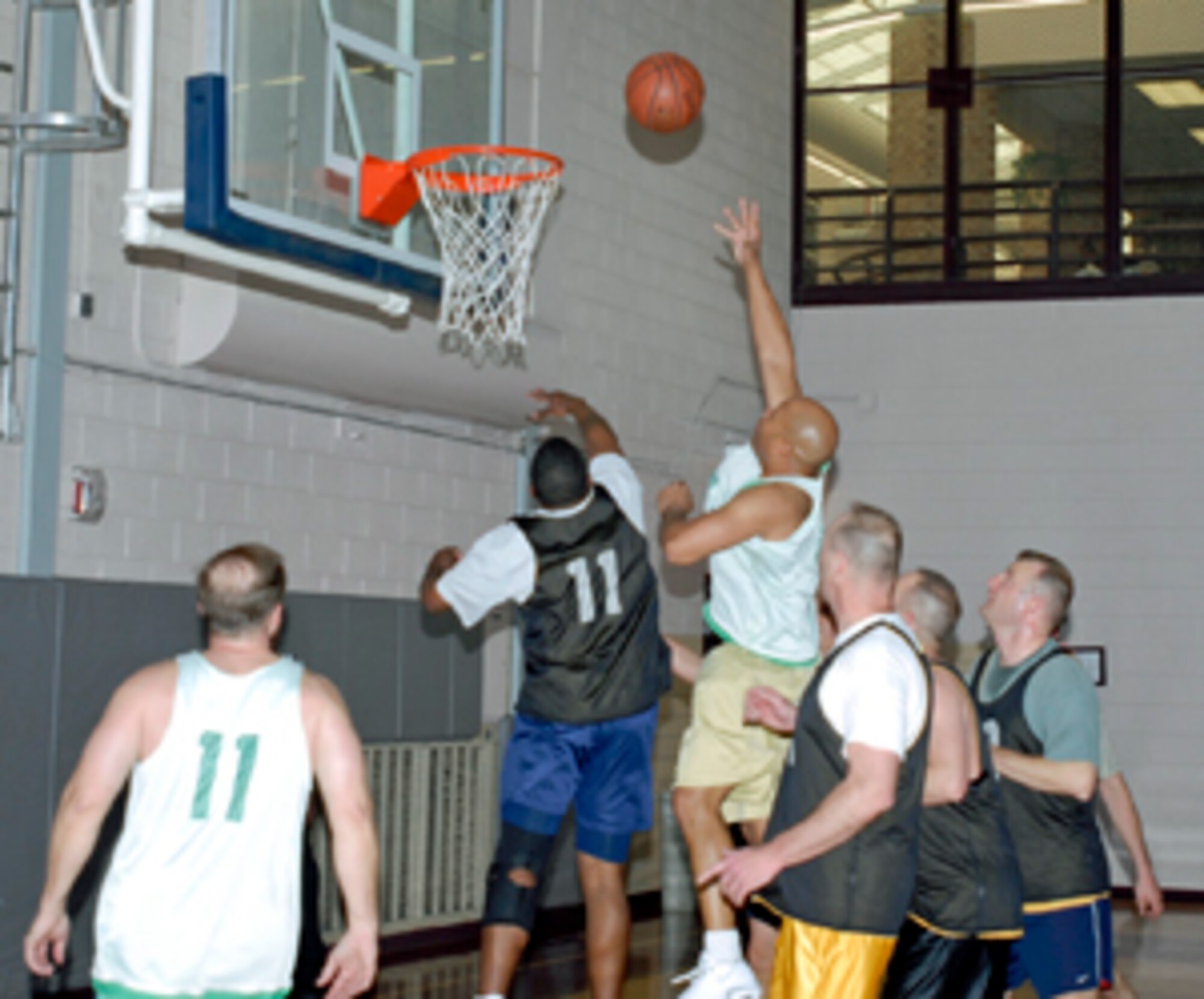 NORTHCOM J2 defeated the 21st Operations Group, 59-31, in Over-30 Intramural Basketball, Feb. 3, at Peterson AFB, Colo.