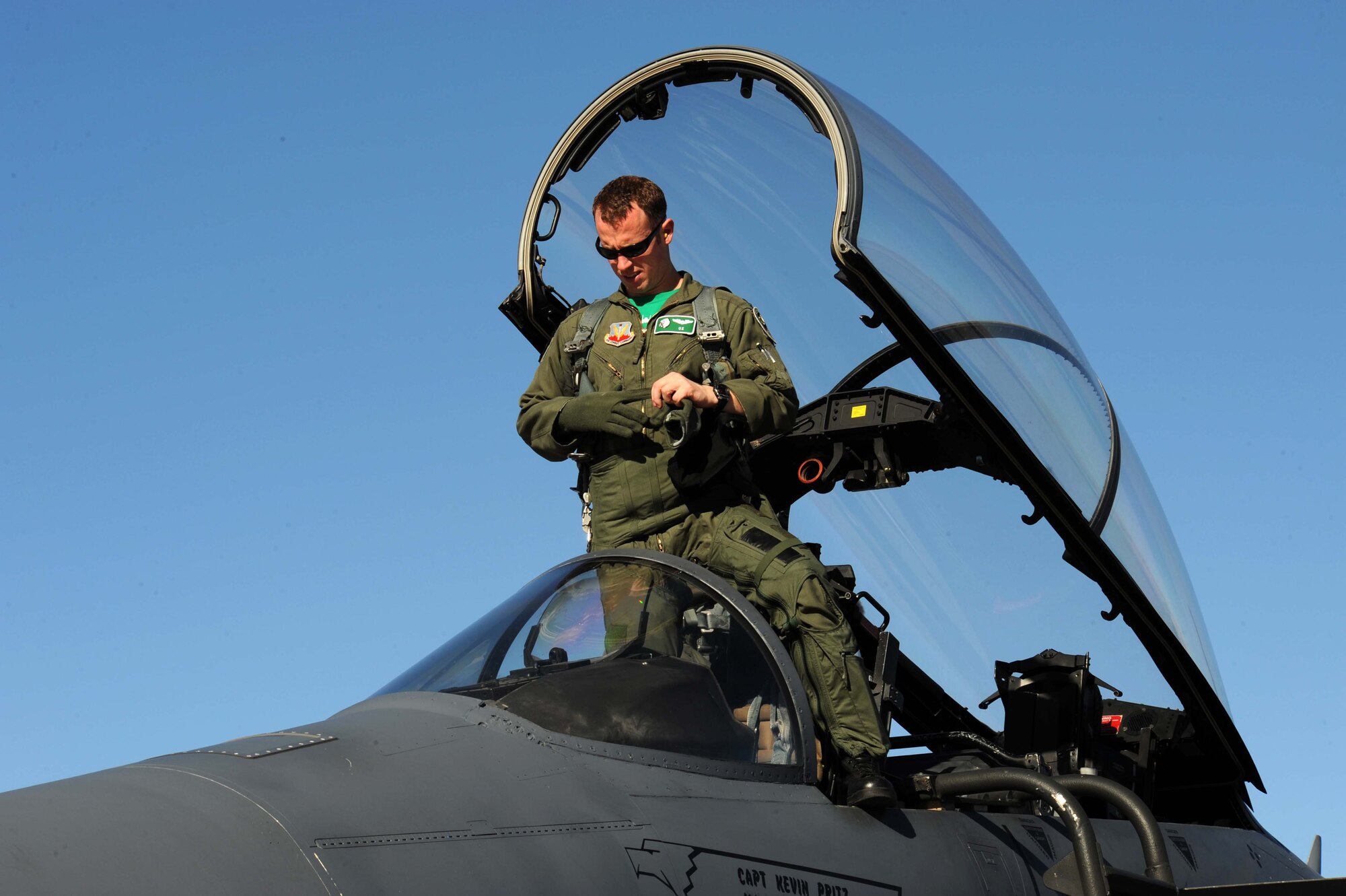 Captain Michal Polidor, an F-15E Strike Eagle pilot assigned to the 333rd Fighter Squadron, Seymour Johnson Air Force Base, N.C., prepares to exit his jet after a training mission during Red Flag 09-2 at Nellis AFB, Nev., Jan. 30. Red Flag is a multi-national exercise providing a realistic environment to practice combat scenarios. The experience gained during the exercise is vital to the survival of air crews in combat. (U.S. Air Force photo/Senior Airman Larry E. Reid Jr.)
