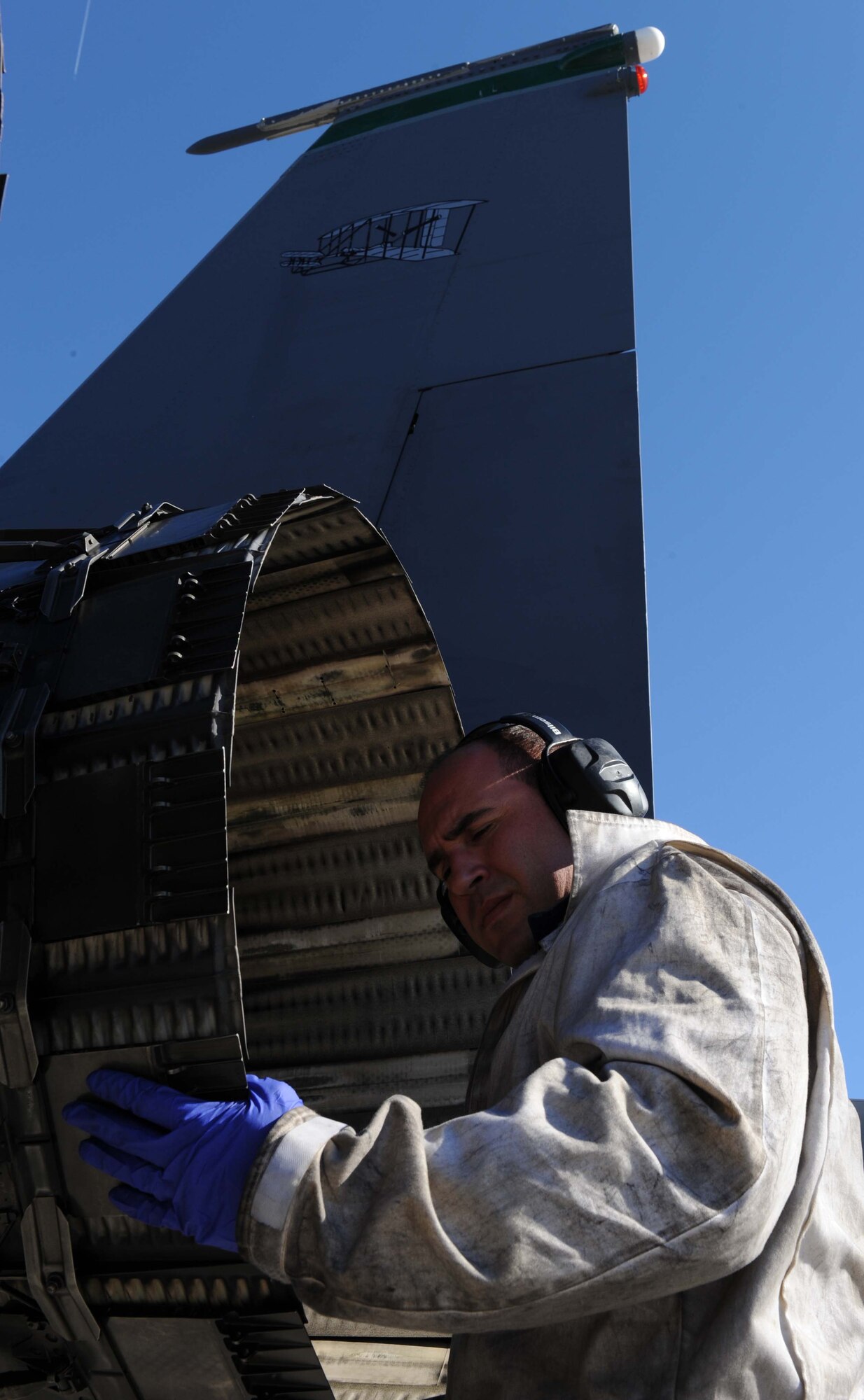 Staff Sgt. Eric Ruiz, assigned to the 4th Aircraft Maintenance Squadron at Seymour Johnson Air Force Base, N.C., inspects the exhaust of an F-15E Strike Eagle during the Red Flag 09-2 exercise at Nellis AFB, Nev., Jan. 30. Red Flag is a multi-national exercise providing a realistic environment to practice combat scenarios. The experience gained during the exercise is vital to the survival of air crews in combat. (U.S. Air Force photo/Senior Airman Nadine Y. Barclay)