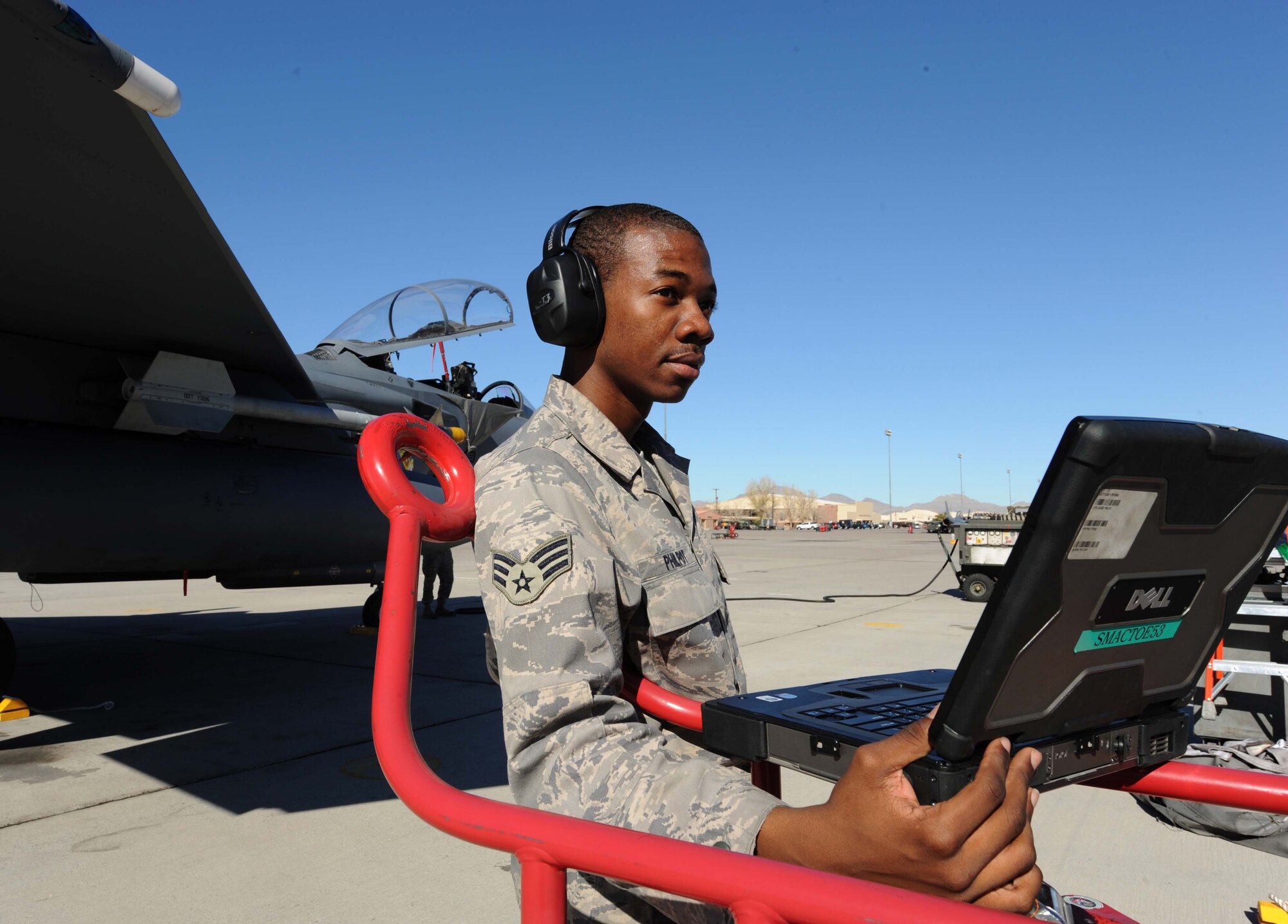 Airman 1st Class Jaguar Philpot, 4th Aircraft Maintenance Squadron at Seymour Johnson Air Force Base, N.C., annotates maintenance done on an F-15E Strike Eagle during the Red Flag 09-2 exercise at Nellis AFB, Nev., Jan. 30. Red Flag is a multi-national exercise providing a realistic environment to practice combat scenarios. The experience gained during the exercise is vital to the survival of air crews in combat. (U.S. Air Force photo/Senior Airman Nadine Y. Barclay)