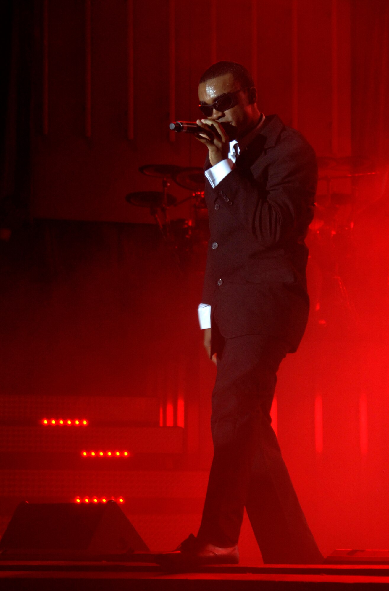 ORPHEUM THEATER, Kan. -- Airman 1st Class Barry Smith, performer for the Air Force’s Tops in Blue, sings and dances to a rendition of “Men in Black” at the Orpheum Theater, Feb. 3. Tops in Blue have presented opportunities to perform for more than 1,700 Airmen during the last 50 years. (Photo by Senior Airman Laura Suttles)