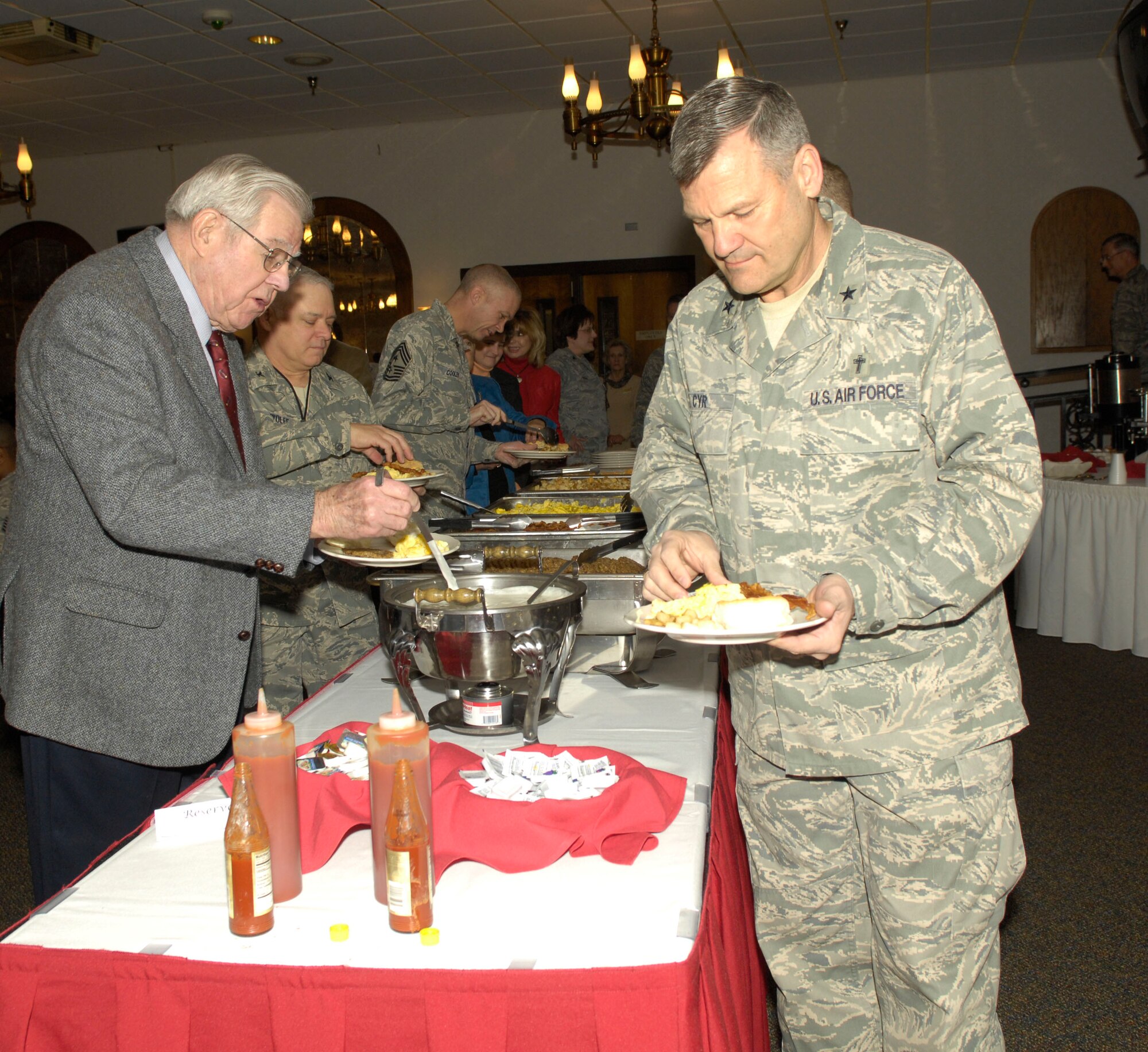 The Air Force deputy chief of chaplains, Chaplain (Brig. Gen) David Cyr (right), was the guest speaker at Barksdale's prayer breakfast. Chaplain Cyr emphasized the importance of faith and prayer in military life. 
