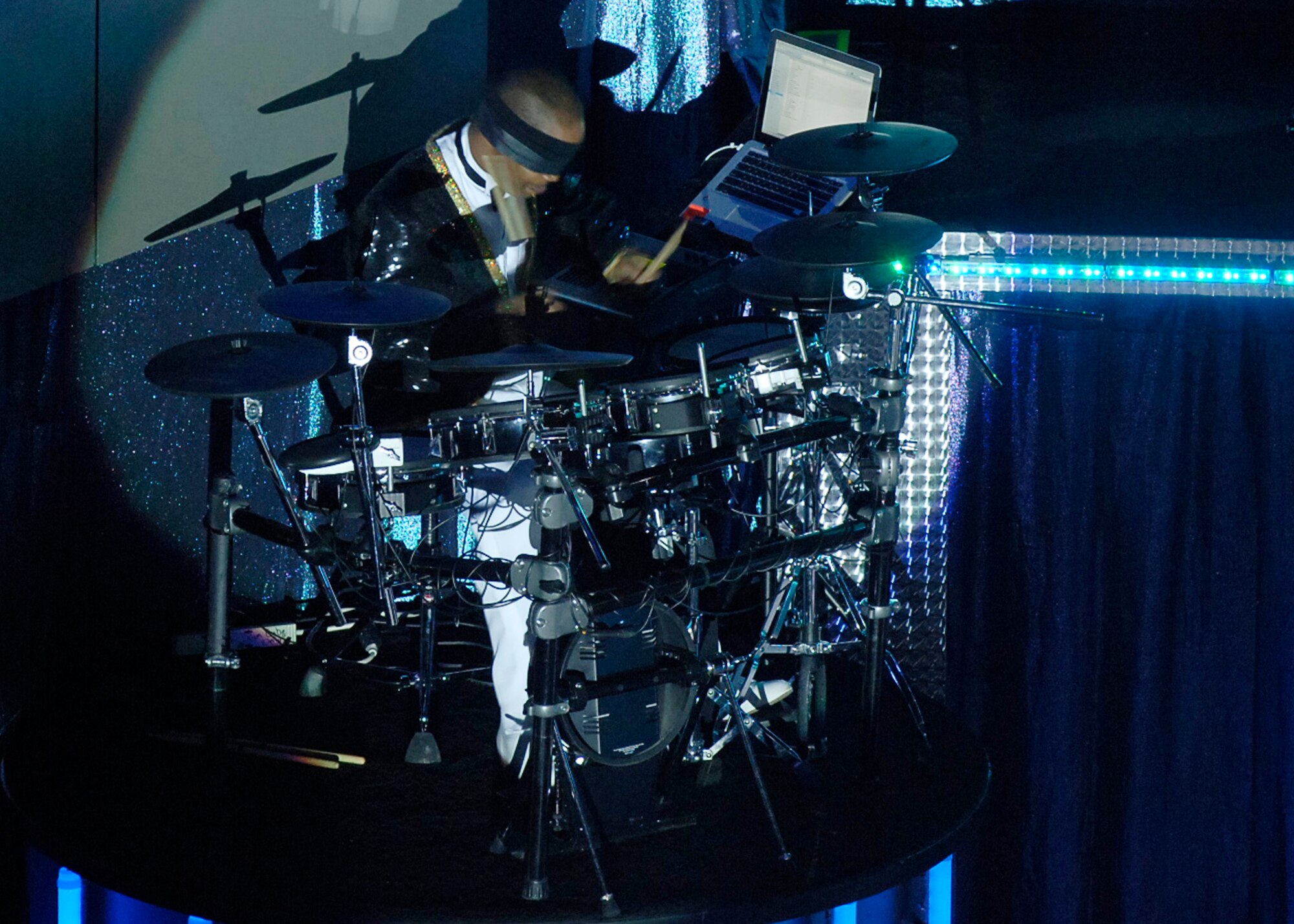 ORPHEUM THEATER, Kan. -- Airman 1st Class Christopher Gadson, 377th Logistics Readiness Squadron, Kirtland Air Force Base, N.M., plays a drum solo blindfolded during the Tops In Blue “Deja Blue” show at the Orpheum Theater, Feb. 3. This year, Tops In Blue celebrates its 55th year of family entertainment. (Photo by Airman 1st Class Maria Ruiz)