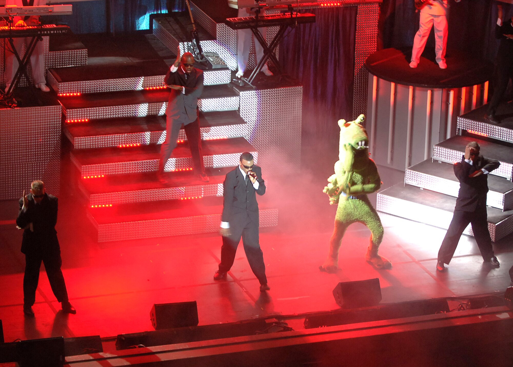 ORPHEUM THEATER, Kan. -- Performers of the Tops In Blue perform the song “Men In Black,” Feb. 3. Other famous songs covered were from movies such as “Beauty and the Beast,” “Titanic” and “Footloose.” (Photo by Airman 1st Class Maria Ruiz)