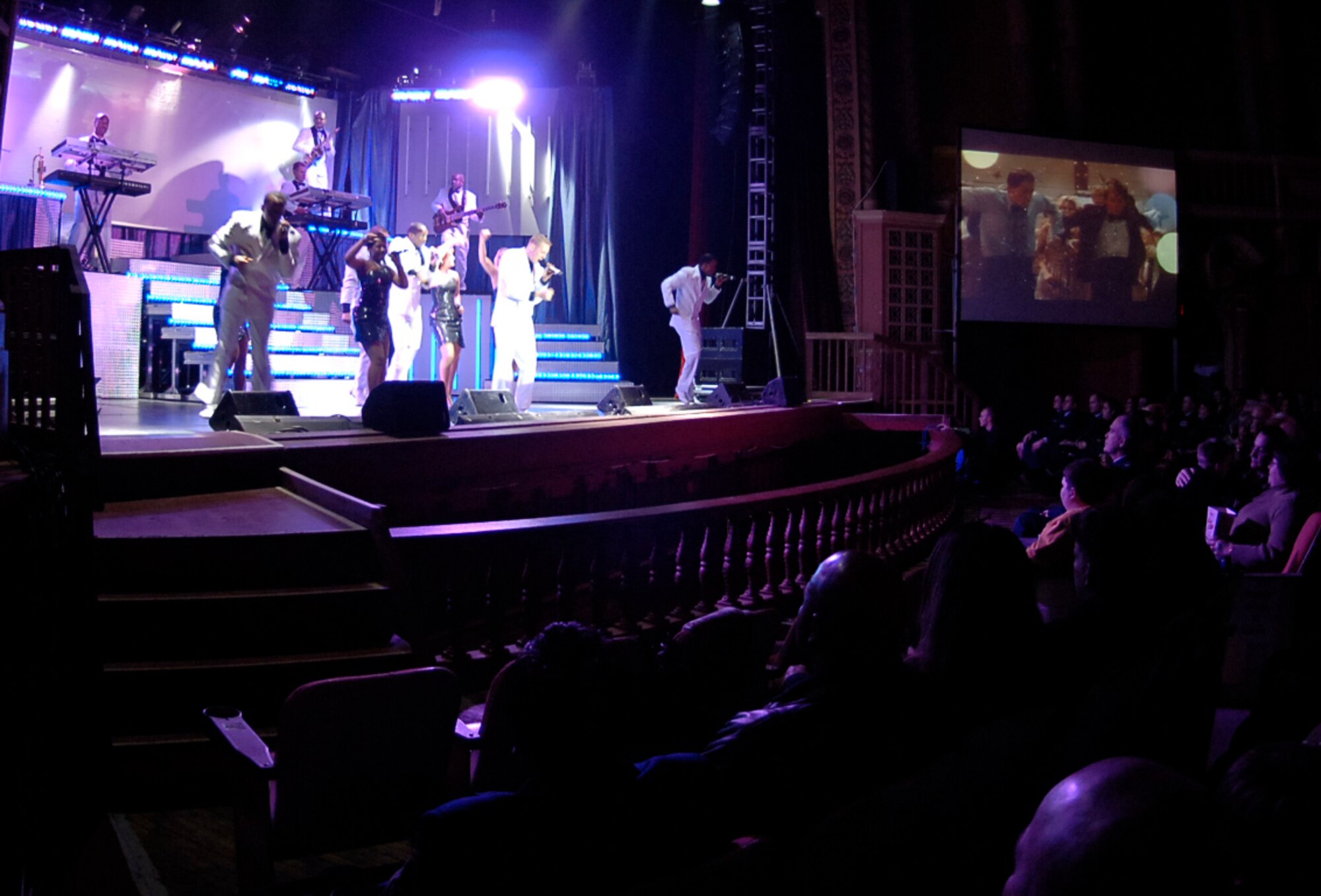 ORPHEUM THEATER, Kan. -- Wichita residents and Team McConnell members watch a free Tops In Blue “Deja Blue” performance at the Orpheum Theater in downtown Wichita, Feb. 3.  More than 800 local military, retired military and Wichita residents came to the show. (Photo by Airman 1st Class Maria Ruiz)