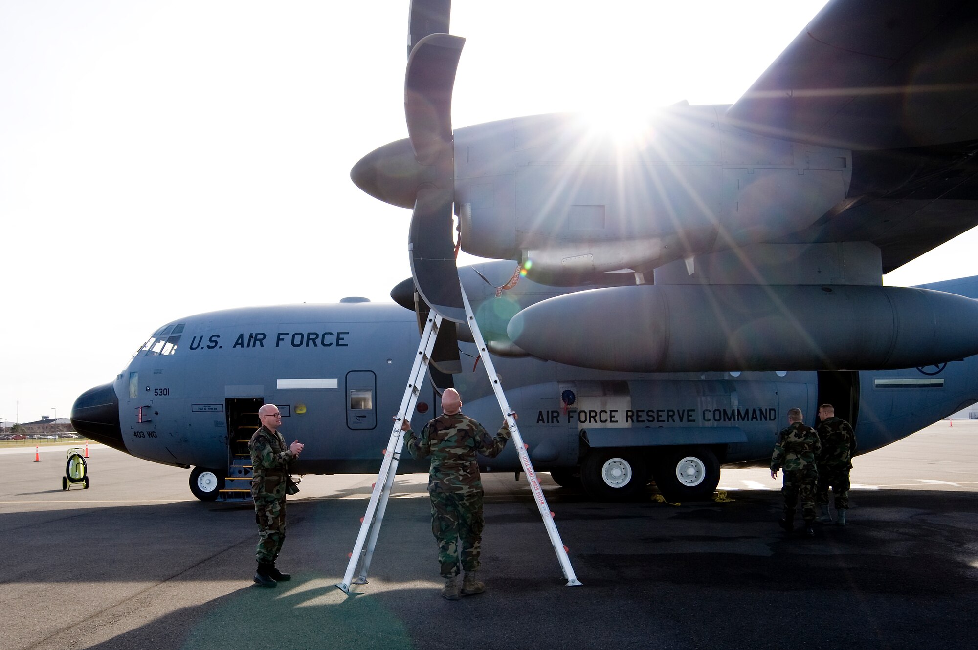 Airmen inspect an Air Force Reserve Command C-130J Hurricane Hunter at McChord Feb. 2. Three C-130J and five C-17 Globemaster III aircraft relocated from Elmendorf AFB, Alaska to McChord this weekend in light of increased activity associated with Mount Redoubt, located 106 miles southwest of Anchorage, Alaska. (U.S. Air Force photo/Abner Guzman)