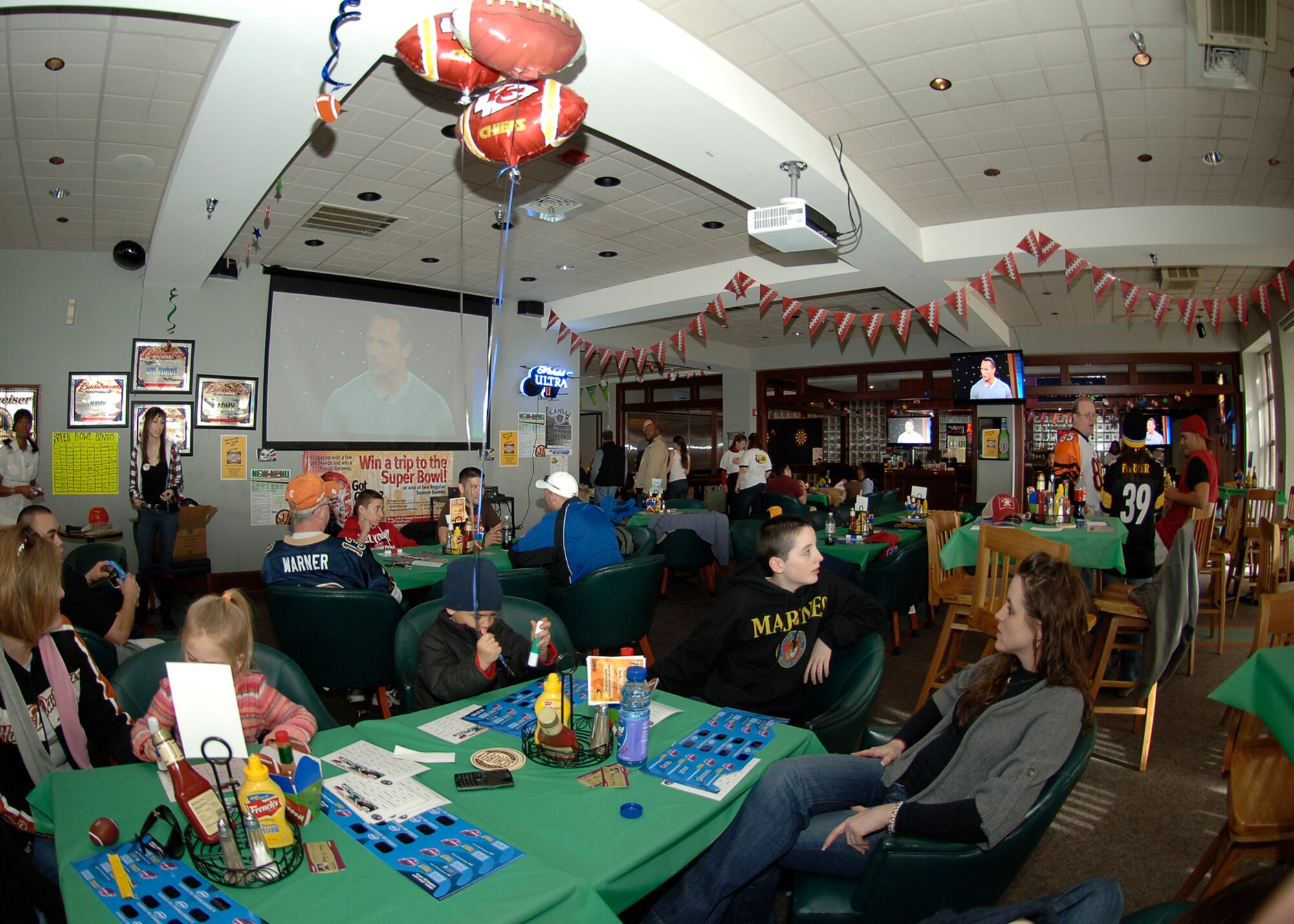 MCCONNELL AIR FORCE BASE, Kan. -- Team McConnell members gather with friends and family to watch Super Bowl XLIII at the Storm Cellar, Feb. 1. During the game, members enjoyed free food and refreshments and a game of football bingo. (Photo by Airman 1st Class Maria Ruiz)
