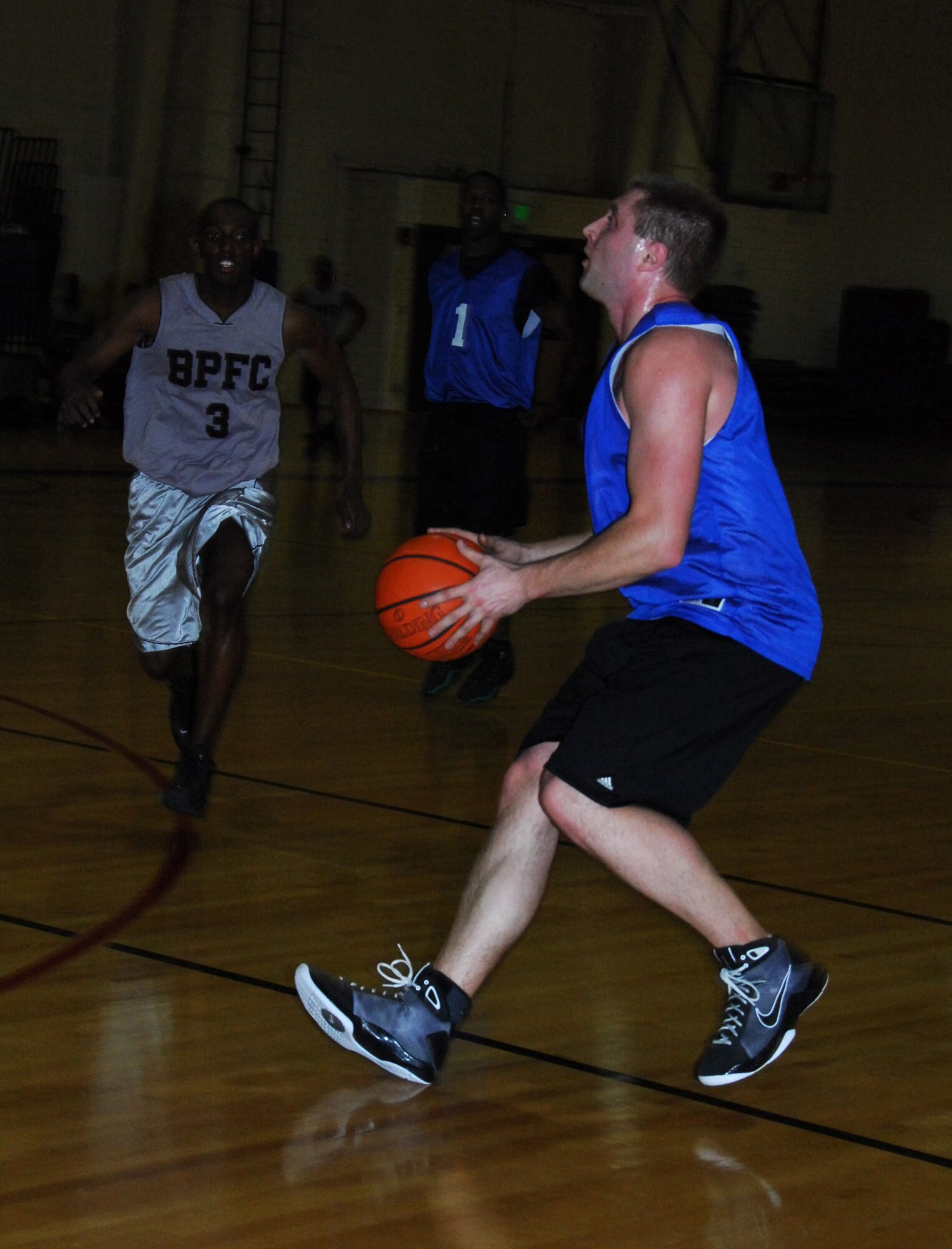 ELMENDORF AIR FORCE BASE, Alaska-- Technical Sgt. Johnathan Orzechowski, 447th Civil Engineer Squadron, goes in for the point during a game against the Army's top team in the Joint Base Elmendorf/Richardson basketball tournament Jan. 28 at the fitness center. (U.S. Air Force photo/1st Lt. Erin Slaughter)