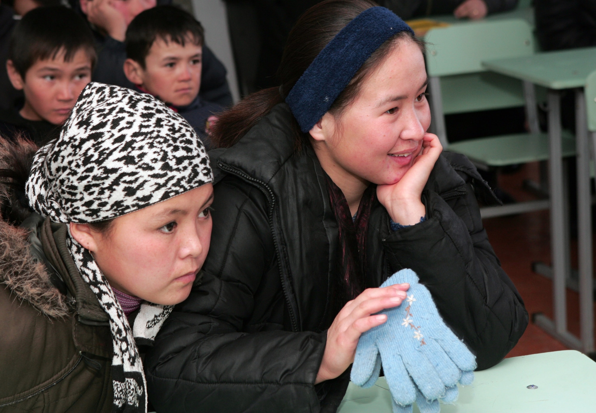 Children from the Jany-Pakhta village school listen intently to the astronauts from the Space Shuttle Endeavour STS-126 mission visiting a Kyrgyzstan village school Jan. 29 near Manas Air Base, Kyrgyzstan. The six crewmembers of the space shuttle spoke of the journey, which launched from Kennedy Space Center in Florida Nov. 14 and returned Nov. 30, 2008. (U.S. Air Force photo/Tech. Sgt. David Jones) 
