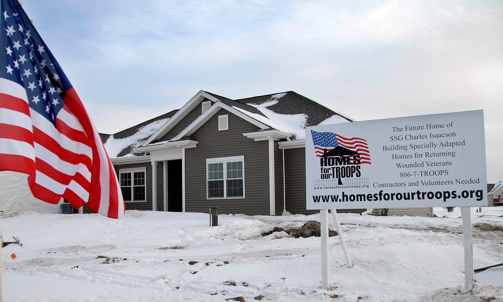 More than 10 Airmen from the 115th Fighter Wing contributed to this newly built home, located in Sun Prairie, for injured Army veteran Staff Sgt. Charles Isaacson and his wife, Brenda, through the Homes for Our Troops Program. The home features many of the special accomodations that Sergeant Isaacson needs to accomodate his injuries from the War on Terror. (U.S. Air Force Photo by Master Sgt. Dan Richardson)