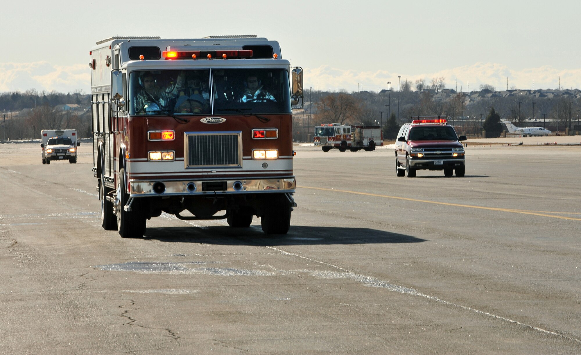 OFFUTT AIR FORCE BASE, Neb. -- 55th Wing first responders arrive at a simulated aircraft accident Feb. 2. Offutt personnel were participating in a Major Accident Response Exercise to enhance their skills and response time if a real accident were to occur. Photo By: Charles Haymond 