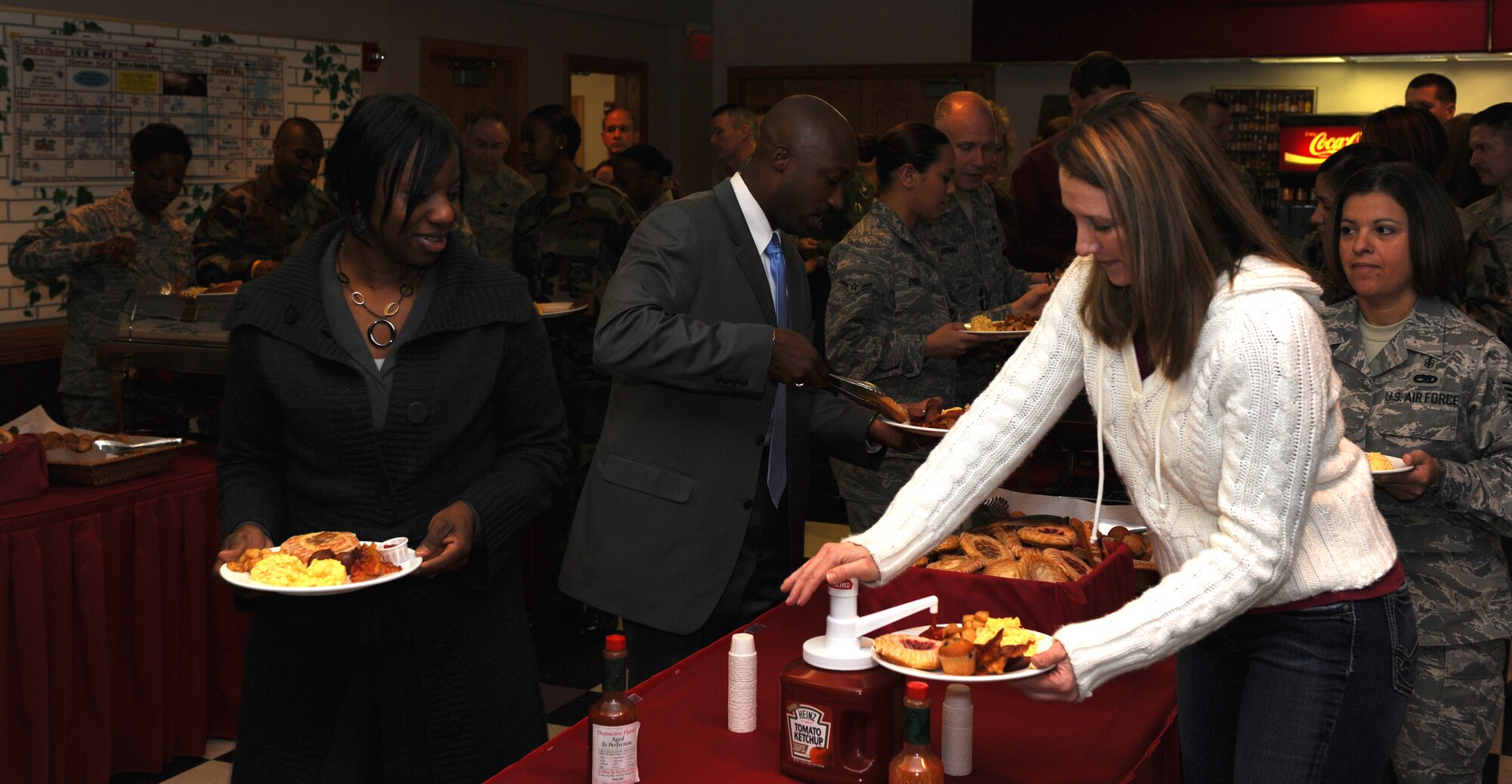 WHITEMAN AIR FORCE BASE, Mo. – Members of Team Whiteman take part in a buffet breakfast Jan. 28 at the Mission’s End during the National Prayer Breakfast. The National Prayer Breakfast provides an opportunity for Team Whiteman members to celebrate the various faiths. (U.S. Air Force photo/Airman 1st Class Carlin Leslie)