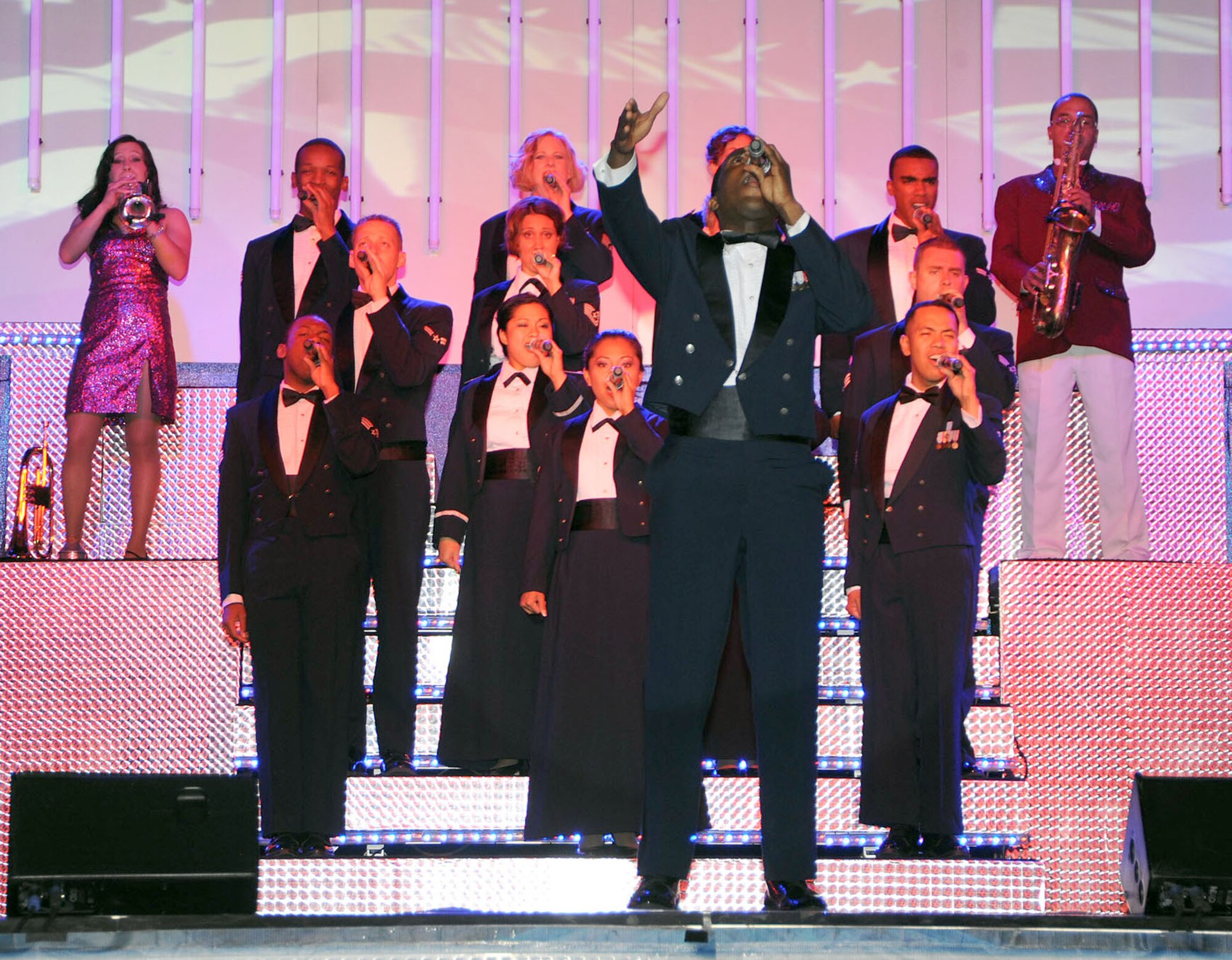 SCOTT AIR FORCE BASE, Ill. -- About 800 people packed Hangar 1 last week to see the Air Force’s elite performance team of Tops in Blue. This year marks the 55th anniversary of the Air Force’s “Expeditionary Entertainers” who presented an action-packed performance showcasing musical hits with their own special spin.  This year's show featured Latin sounds, country music and hits from the top of the charts.  Attendees were treated to music from their favorite movies and Broadway shows as well. (U.S. Air Force photo/Airman 1st Class Wesley Farnsworth)