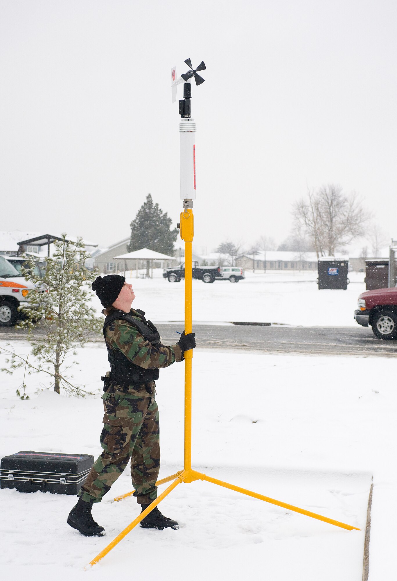 Airman 1st Class Kendra Ketonen, 436th Civil Engineer Squadron Emergency Management Flight, sets up a portable weather station to check wind speed and direction during a Major Accident Response Exercise Jan. 27.  (U.S. Air Force photo/Tom Randle)