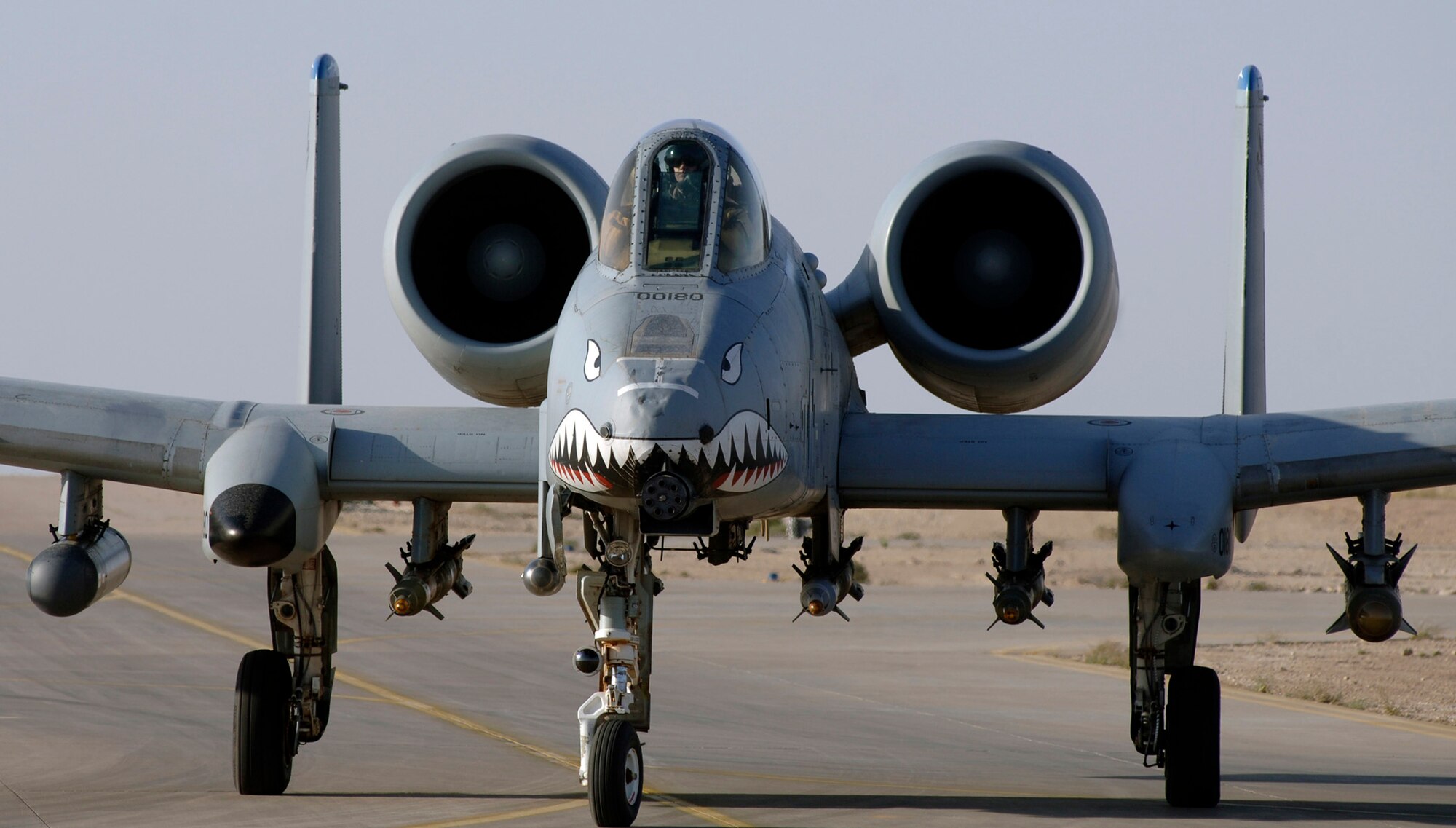 An A-10 Thunderbolt II prepares to take off from a Southwest Asia air base to provide close-air support to ground troops in Iraq.  The A-10s perform shows of force to deter enemy forces and provide top cover for coalition forces.  (U.S. Air Force photo/Tech. Sgt. Cecilio M. Ricardo Jr.) 