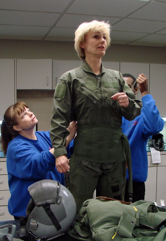 Sharon Trojan, the 71st Mission Support Group honorary commander, has a G-suit fitted by Candie David, left, and Cliff Cherry, life support specialists at Vance AFB. Ms. Trojan received an orientation flight Feb. 3 in a T-6 flown by Capt. Nathan Perry with the 33rd Flying Training Squadron. Ms. Trojan, a member of the Northern Oklahoma College/Northwestern Oklahoma State University advisory board and local certified public accountant, has spent the past year learning about the Air Force and Vance AFB while paired with Col. Jennifer Graham, the 71st MSG commander. The honorary commander program is designed to create a better understanding between Vance commanders and local business and community leaders. (U.S. Air Force photo by Joe B. Wiles)