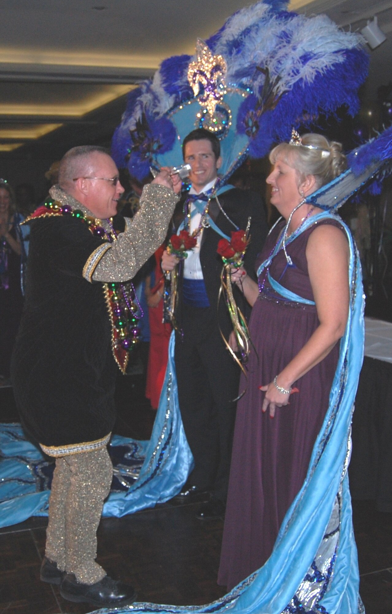 Brig. Gen. Dan Wyman, 81st Medical Group commander, is decked out in medieval garb to crown the king and queen of the medical center’s 21st annual Krewe of Medics ball, Saturday at the Imperial Palace Casino and Resort.  This year’s royalty are Maj. (Dr.) Charles Greeson, 81st Medical Operations Squadron, and Joann Griggs, 81st Diagnostics and Therapeutics Squadron.  (U.S. Air Force photo by Steve Pivnick)