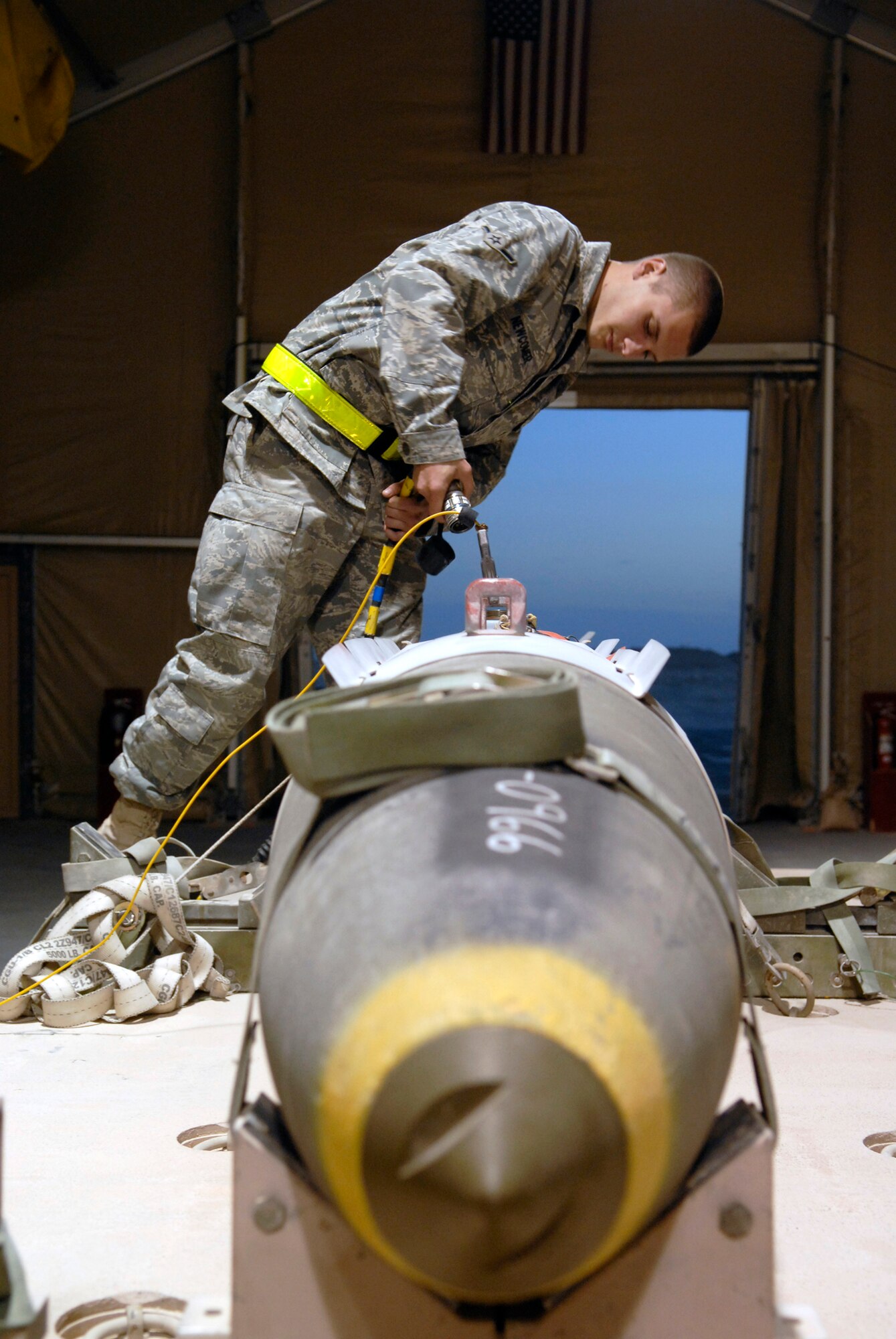 Airman Bryan Newcomer, a 379th Expeditionary Maintenance Squadron Ammunitions Systems Apprentice, checks the convention ammunitions bit reprogramming equipment on the tail kit of a GBU-31 bomb Feb. 3, 2009, at an undisclosed location in Southwest Asia.  Airman Newcomer hails from Suwanee, Ga. and is deployed from Dyess AFB, Texas in support of Operation Iraqi and Enduring Freedom and Combined Joint Task Force- Horn of Africa.  (U.S. Air Force Photo by Airman 1st Class Andrew Satran/Released)
