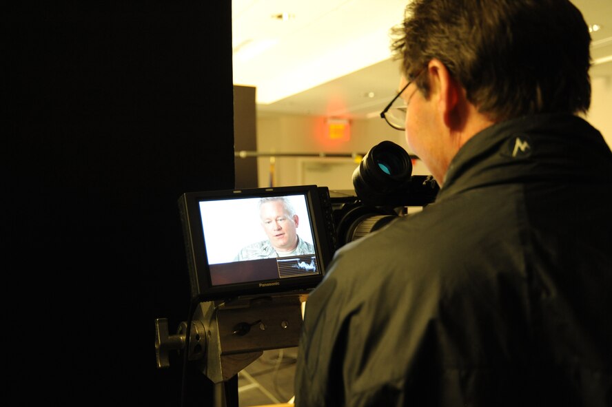 A contracted cameraman films Col. Chris Doran, Air Mobility Command Terminal-21’s manager, during an Air Force Smart Operations for the 21st Century interview at the 436th Aerial Port Squadron on Dover Air Force Base Jan. 30.  The AFSO-21 video filmed at Dover is scheduled to be used Air Force wide. (U.S. Air Force photo/Master Sgt. Joseph Springfield)