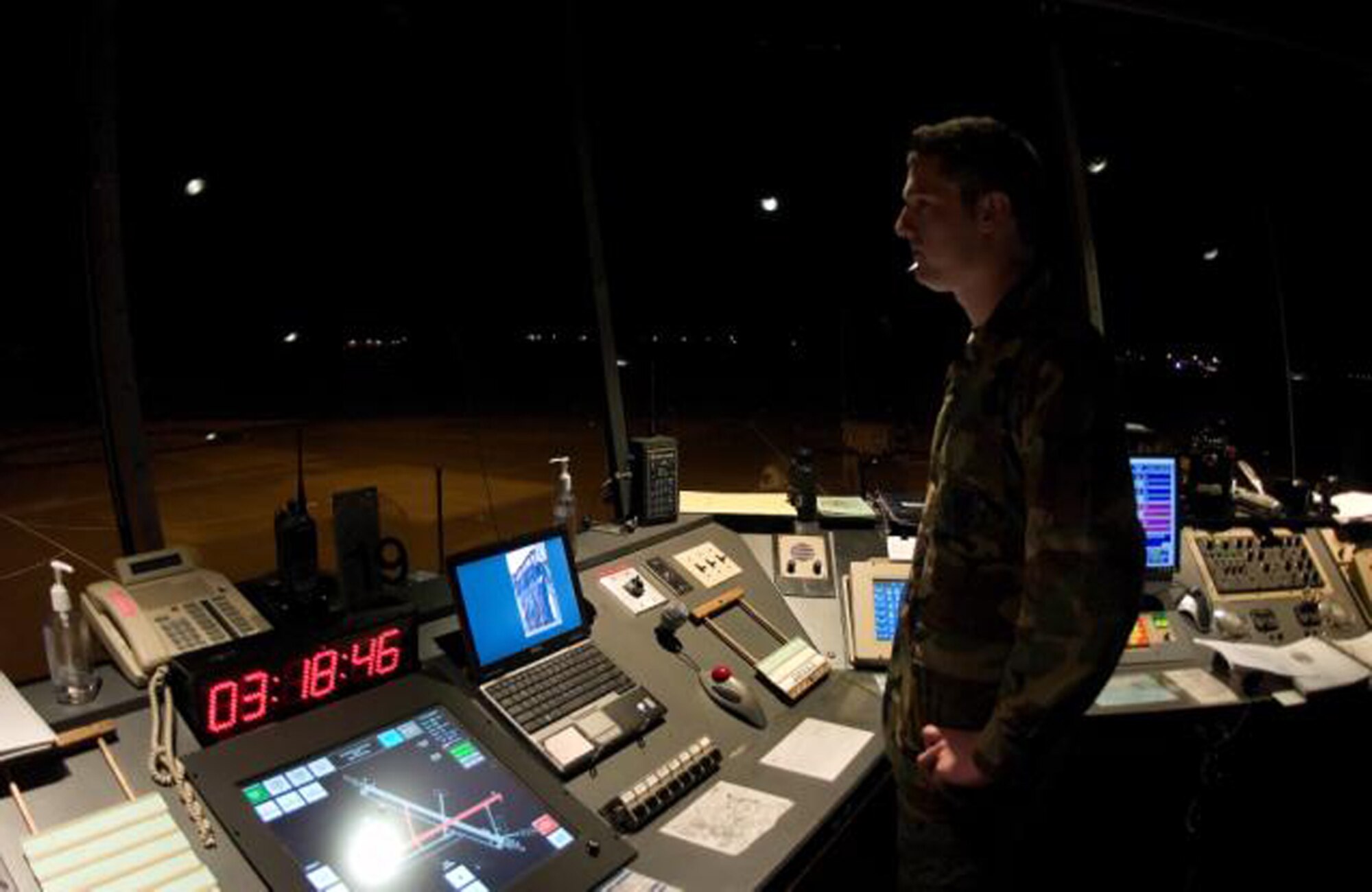Airman 1st Class Michael Strickler, 436th Operations Support Squadron, monitors the runway here. (U.S. Air Force Photo / Jason Minto) 