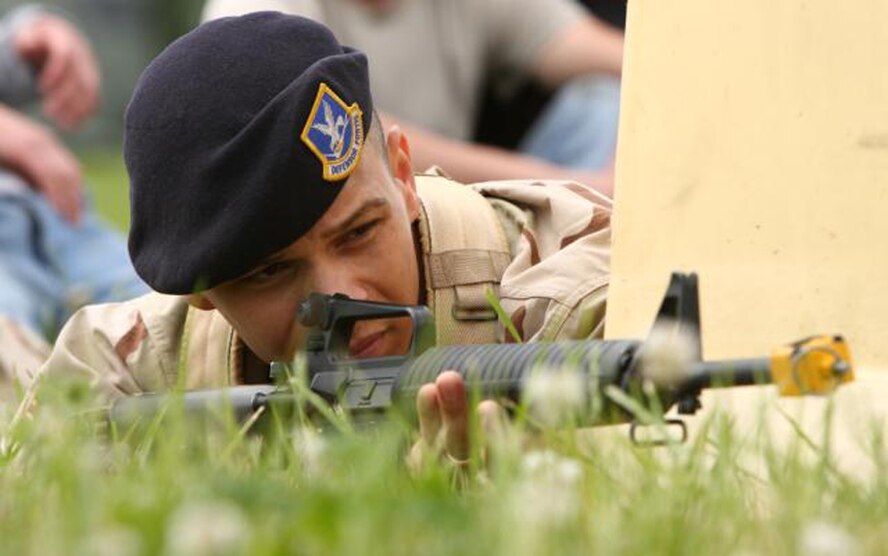 Senior Airman Feilix Miranda, 436th Security Forces Squadron, takes aim at potential threats during an exercise. (U.S. Air Force Photo / Roland Balik) 