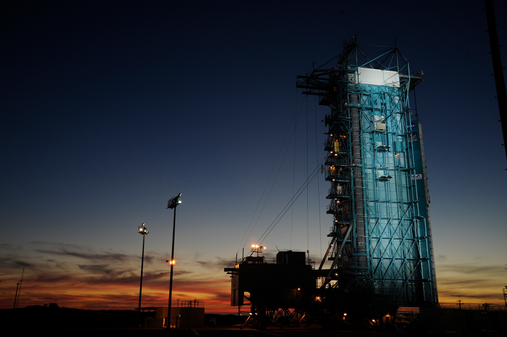 VANDENBERG AIR FORCE BASE, Calif.  -- A launch tower retracts, exposing a Delta II rocket hours before launch Feb. 3. The rocket is carrying a NOAA-N Prime polar-orbiting weather satellite for NASA and the National Oceanic and Atmospheric Administration. (U.S Air Force photo/Senior Airman Stephanie Longoria)