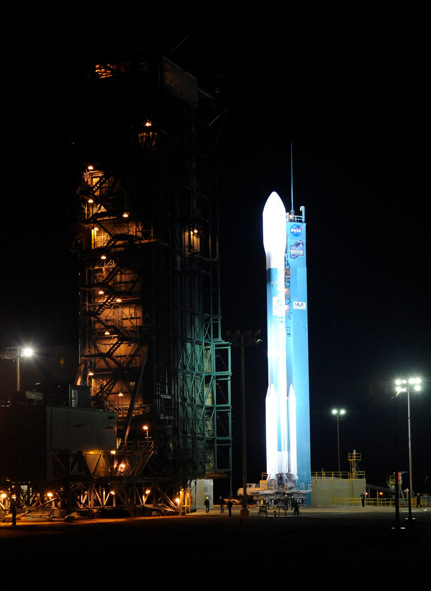 VANDENBERG AIR FORCE BASE, Calif.  -- A launch tower retracts, exposing a Delta II rocket hours before launch Feb. 3. The rocket is carrying a NOAA-N Prime polar-orbiting weather satellite for NASA and the National Oceanic and Atmospheric Administration. (U.S Air Force photo/Senior Airman Stephanie Longoria)
