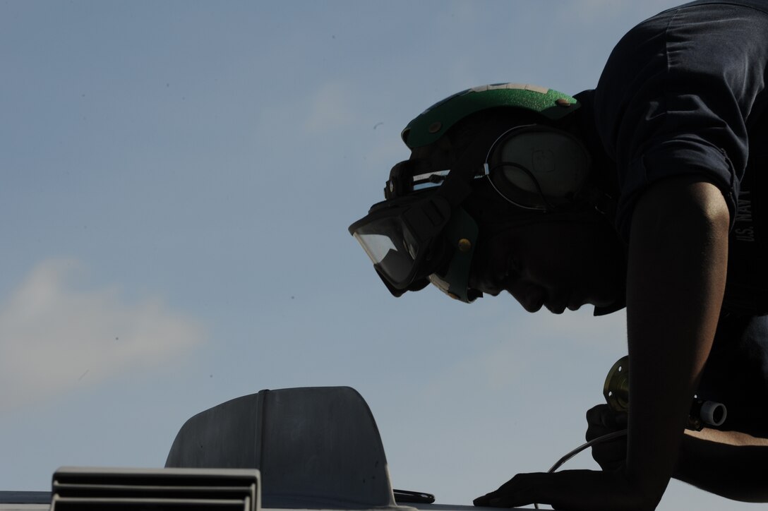 Petty Officer1st Class Christopher Carr, aviation electricians mate works on a EA-6B Prowler leading edge flap Feb. 3 at Andersen Air Force Base, Guam after a local area mission during exercise Cope North 09-1. Navy EA-6B Prowlers from VAQ-136 Carrier Air Wing Five, Atsugi, Japan along with Japan Air Self Defense Force F-2s  from the 6th Squadron, Tsuiki Air Base and E-2Cs from the 601st Squadron, Misawa Air Base will join forward deployed USAF  F-16 Fighting Falcons from the 18th Aggressor Squadron, Eielson Air Force Base, Alaska, B-52 Stratofortress' currently deployed to Andersen AFB, Guam from the 23rd Expeditionary Bomb Squadron will participate in this year's Cope North exercise Feb. 2-13, with a focus on interoperability. (U.S. Air Force photo/ Master Sgt. Kevin J. Gruenwald) 