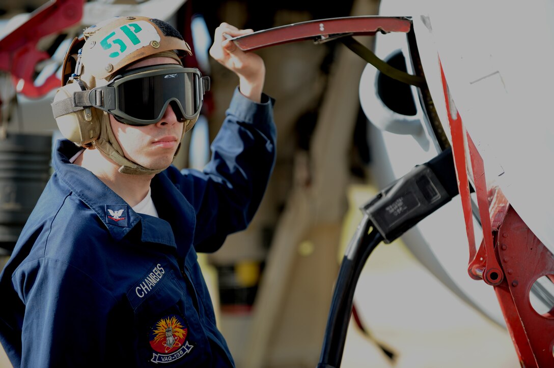 U.S. Navy Petty Officer 3rd class Curtis Chambers avionics technician performs pre-flight checks on an EA-6B Prowler, Feb. 3 at Andersen Air Force Base, Guam after a local area mission during exercise Cope North 09-1. Navy EA-6B Prowlers from VAQ-136 Carrier Air Wing Five, Atsugi, Japan along with Japan Air Self Defense Force F-2s  from the 6th Squadron, Tsuiki Air Base and E-2Cs from the 601st Squadron, Misawa Air Base will join forward deployed USAF  F-16 Fighting Falcons from the 18th Aggressor Squadron, Eielson Air Force Base, Alaska, B-52 Stratofortress' currently deployed to Andersen AFB, Guam from the 23rd Expeditionary Bomb Squadron will participate in this year's Cope North exercise Feb. 2-13, with a focus on interoperability. (U.S. Air Force photo/ Master Sgt. Kevin J. Gruenwald) released      