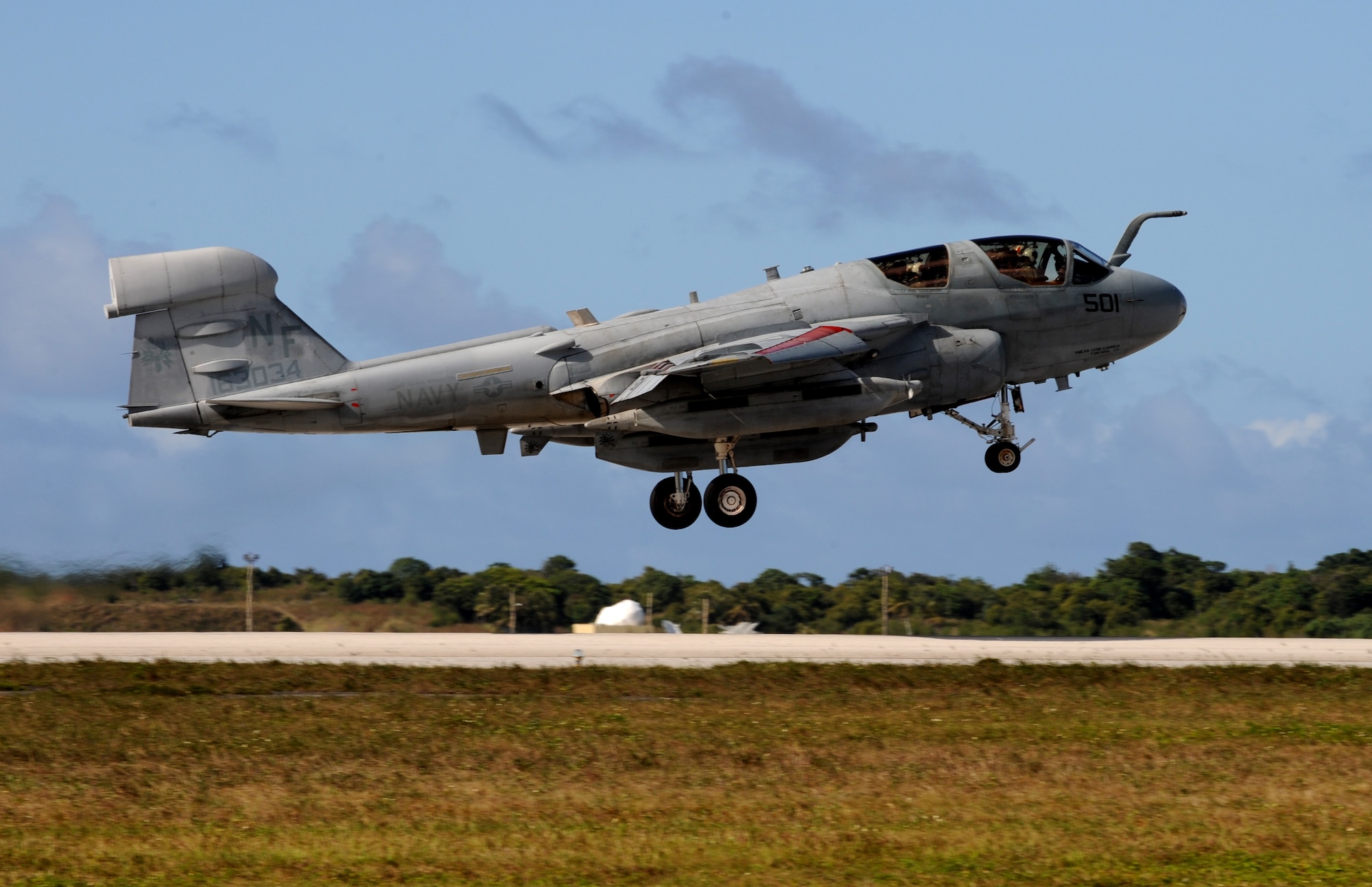 U.S. Navy EA-6B Prowler gets airborne Feb. 3 at Andersen Air Force Base, Guam prior to a local area mission during exercise Cope North 09-1. Navy EA-6B Prowlers from VAQ-136 Carrier Air Wing Five, Atsugi, Japan along with Japan Air Self Defense Force F-2s  from the 6th Squadron, Tsuiki Air Base and E-2Cs from the 601st Squadron, Misawa Air Base will join forward deployed USAF  F-16 Fighting Falcons from the 18th Aggressor Squadron, Eielson Air Force Base, Alaska, B-52 Stratofortress' currently deployed to Andersen AFB, Guam from the 23rd Expeditionary Bomb Squadron will participate in this year's Cope North exercise Feb. 2-13. The Cope North exercise is one of the longest-running series of exercises in the Pacific theater.  Since the first Cope North exercise in 1978, thousands
of American and Japanese personnel have honed skills that are vital to
maintaining a high level of readiness. This will be the tenth time the United States and Japan have held a Cope North exercise on Guam, and it will be the fourth time that the JASDF will use live ordnance.
 
(U.S. Air Force photo/ Master Sgt. Kevin J. Gruenwald) released





















  












 











































  












 

























