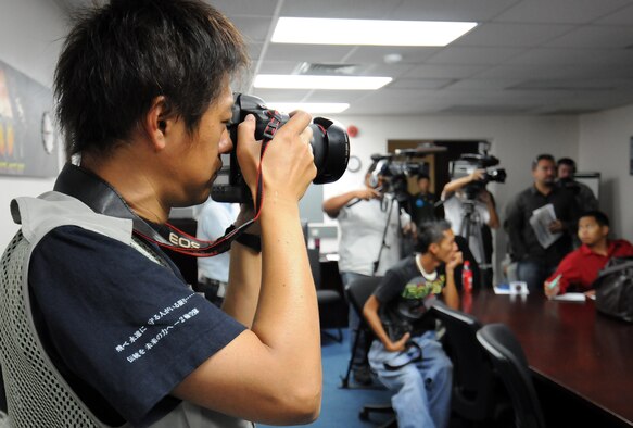 ANDERSEN AIR FORCE BASE, Guam - Japanese photographer Hajime Ishihara documents a Cope North press conference here Feb. 4. The Cope North exercise is one of the longest-running series of exercises in the Pacific theater. Since the first Cope North exercise in 1978, thousands of American and Japanese personnel have honed skills that are vital to maintaining a high level of readiness. The exercise has been in the planning stages for several months and bears no connection to any real-world events. This will be the 10th Cope North exercise held here, and it will be the fourth time that the JASDF will use live ordnance.(U.S. Air Force photo by Airman 1st Class Courtney Witt)