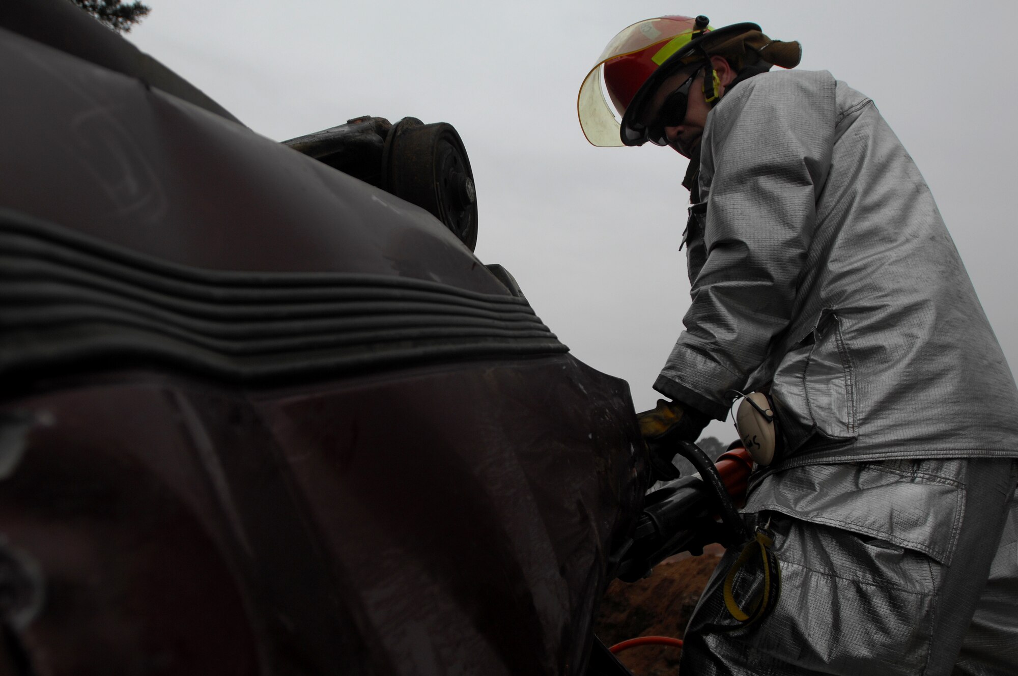 Tech. Sgt Tim Smith, a 835th Civil Engineer Squadron firefighter, uses new heavy equipment during a U.S. Air Forces in Europe firefighter training exercise, Jan. 28, 2009, at Ramstein Air Base. Firefighters participated in a two-week accident response training course. (U.S. Air Force photo by Airman 1st Class Kenny Holston)