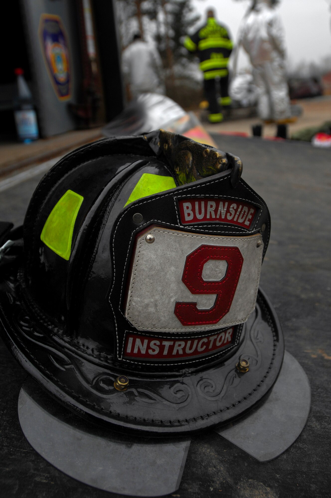 A fire helmet lies on the ramp of a fire truck while firefighters wait for a training class to begin Jan. 28, 2009, at Ramstein Air Base. Firefighters participated in a two-week accident response training course. (U.S. Air Force photo by Airman 1st Class Kenny Holston) 
