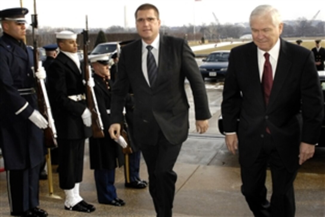 Defense Secretary Robert M. Gates, right, escorts Bulgarian Minister of Defense Nikolay Tsonev through an honor cordon into the Pentagon to discuss bilateral defense issues, Feb. 4, 2009.