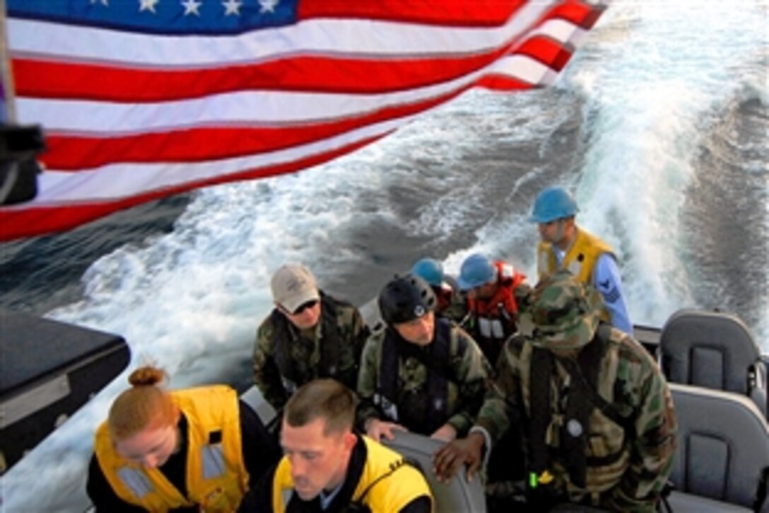 U.S. Navy sailors assigned to the amphibious transport dock ship USS Nashville ride a rigid hull inflatable boat in the Atlantic Ocean to the pier in Dakar, Senegal, Feb. 3, 2009, to prepare for Nashville's arrival. Nashville is deployed as a part of Africa Partnership Station 2009, an international initiative developed by Naval Forces Europe and Naval Forces Africa to improve maritime safety and security.