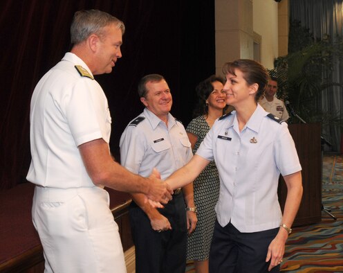 ANDERSEN AIR FORCE BASE, Guam – Rear Admiral William French, U.S. Naval Forces Marianas commander, presents the Combined Federal Campaign silver award to Lt. Col. Kathleen Grasse, 36th Communications Squadron commander, during the CFC award ceremony Feb. 2 at the Hilton Guam Resort & Spa. Team Andersen raised more than $153,000 this year. (U.S. Air Force photo by Staff Sgt. Jamie Lessard) 