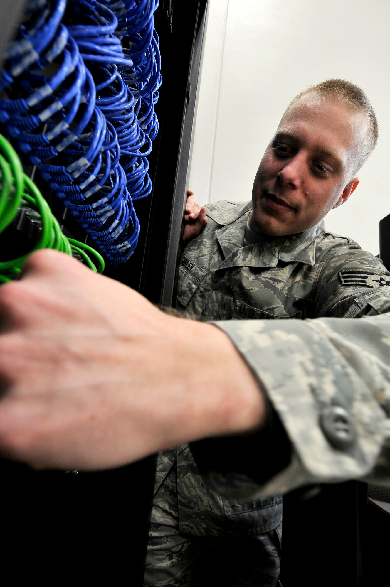 MISAWA AIR BASE, Japan -- Senior Airman Jesse Sibley, 35th Communications Squadron, Blue Team member, works on a squadron server Feb. 04, 2009.  The Misawa Blue Team helps people recognize threats to the computer network infrastructure and perform all the proper steps to report any suspicious activity.  (U.S. Air Force photo by Senior Airman Chad C. Strohmeyer)