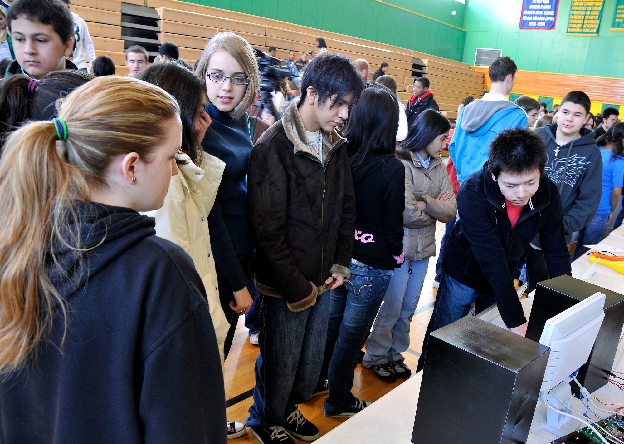 MISAWA AIR BASE, Japan -- Yuta Araya, Hachinohe National College of Technology student, shows Edgren High School students, Feb. 4, 2009, the motion-sensored video game his class created. Mr. Araya has been a student with the Hachinohe National College of Technology for five years. (U.S. Air Force photo by Senior Airman Chad C. Strohmeyer)