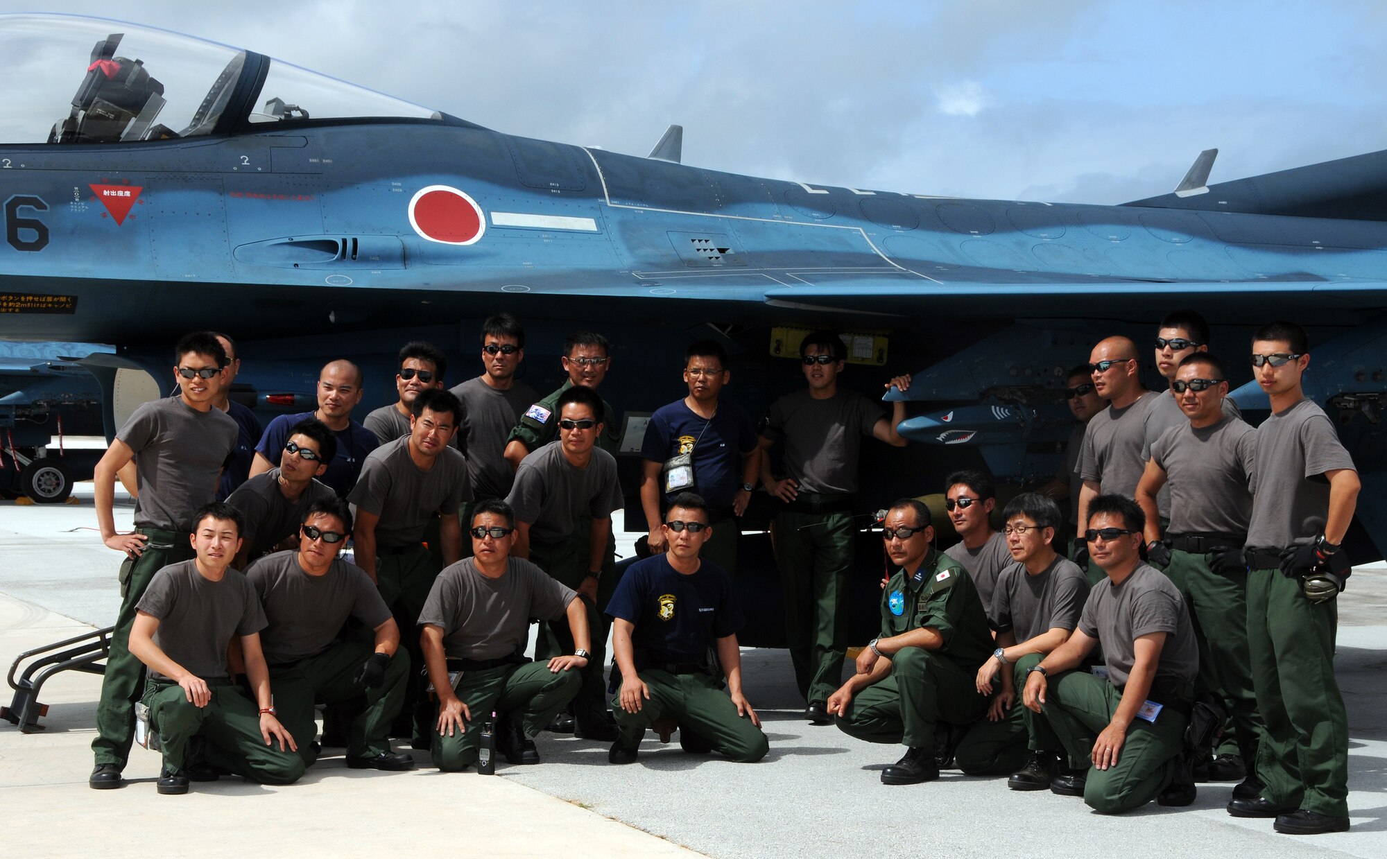 ANDERSEN AIR FORCE BASE, Guam - Japan Air Self Defense Force gather together for a quick group photo on the flightline here in front of their own F2-X fighter jet from the 6th Squadron, Tsuiki Air Base, Japan Feb. 5. JASDF squadrons are participating in Cope North, an exercise designed to enhance U.S. and Japanese air operations in defense of Japan. (U.S. Air Force photo by Airman 1st Class Courtney Witt)(released)

