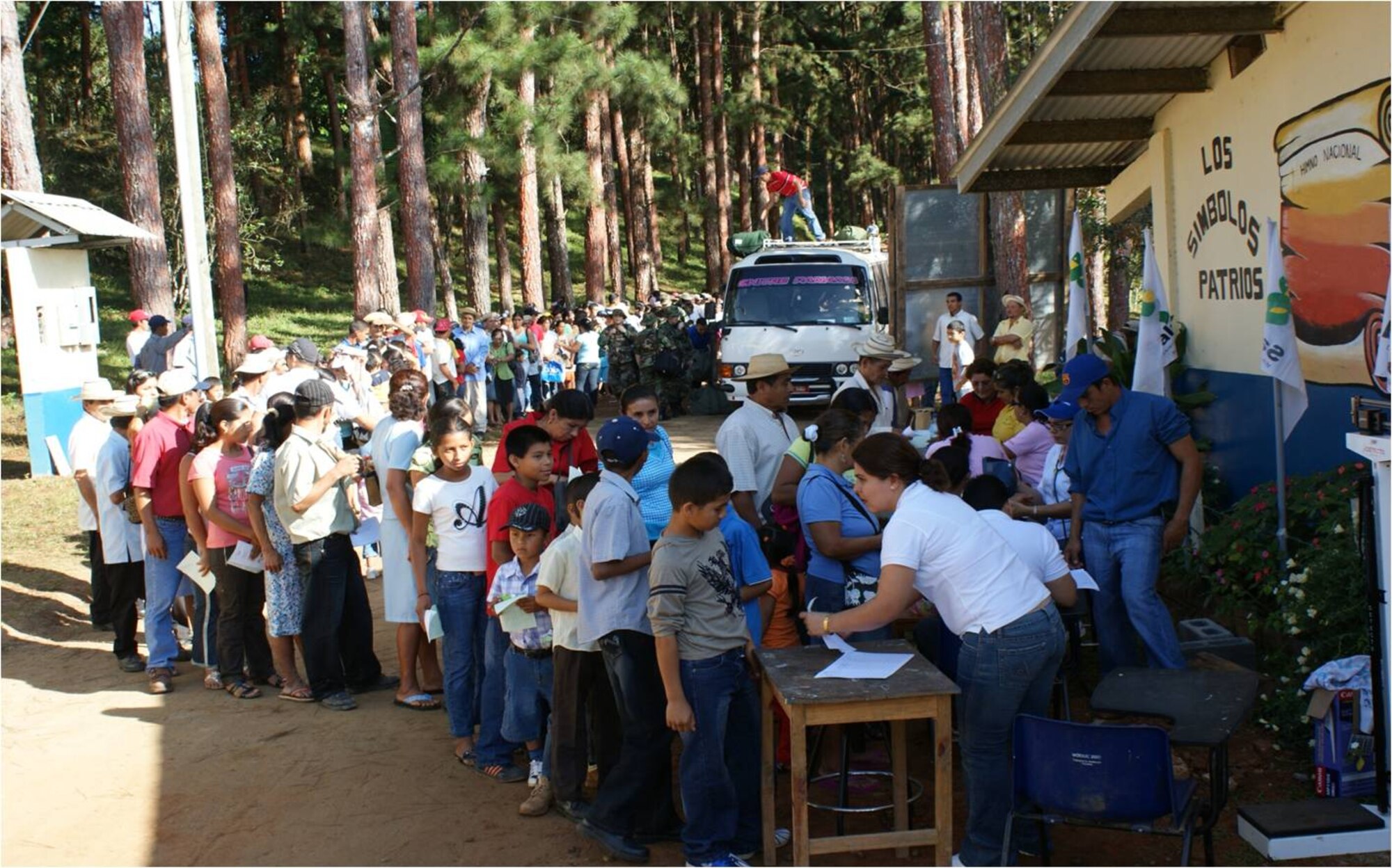 Patients stand in line after trekking to the treatment site from as far as four hours away. MEDRETE personnel are trained to handle large groups of people. (U.S. Air Force photo)