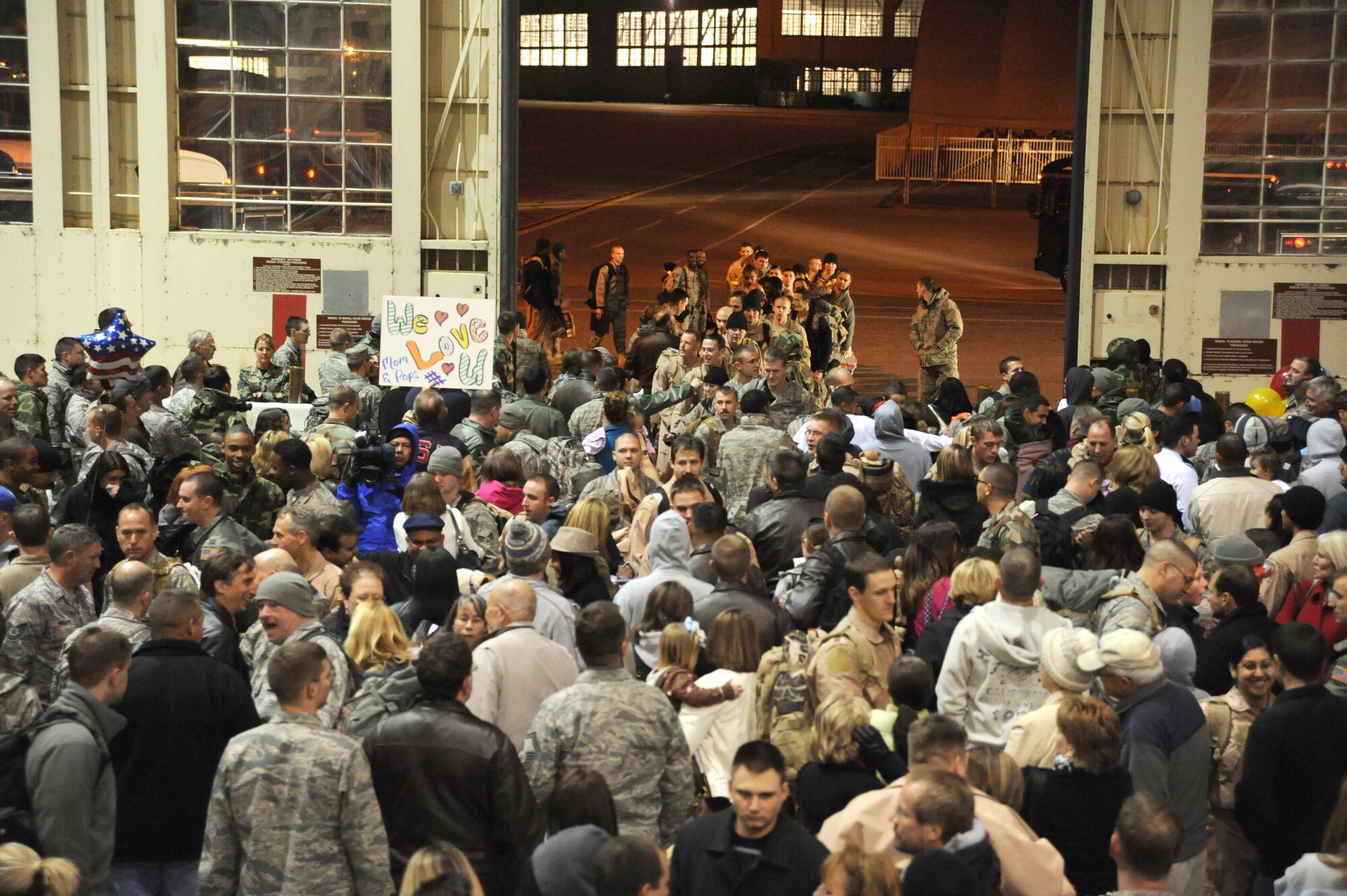 The families, friends and co-workers of 150 Hurlburt Airmen crowd Eglin Air Force Base's King Hangar during the Operation Homecoming ceremony Feb. 4. The Airmen were returning home from deployments to the Middle East. (U.S. Air Force photo/Senior Airman Stephanie Jacobs)