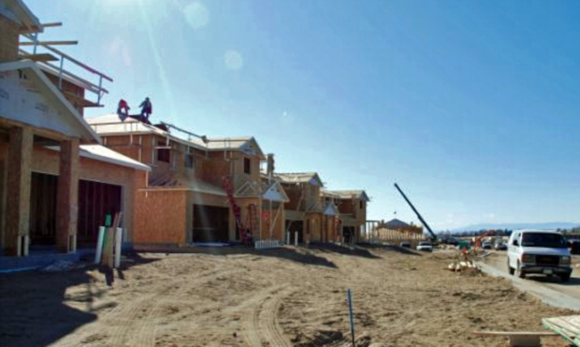 Construction workers work on new Peterson AFB housing.