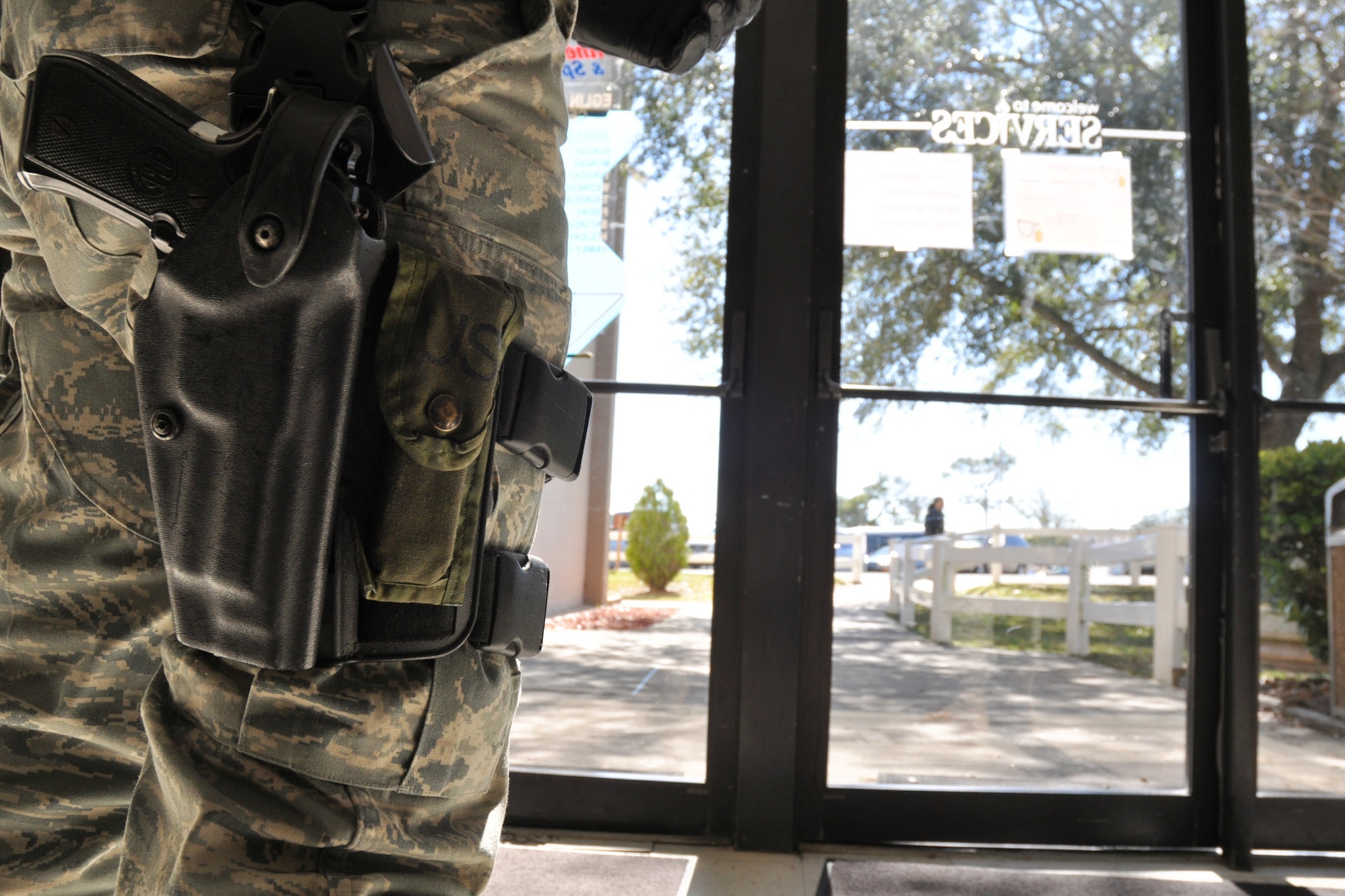 EGLIN AIR FORCE BASE, Fla. -- Airman 1st Class Donald Bacha, 96th Security Forces, stands guard ensuring tight security at the Eglin Fitness Center during an exercise Feb. 4, preventing the spread of a simulated pandemic of a form of the pneumonic plague. As a result of the simulated plague, the base hospital became the main Triage Site where medical personnel diagnosed the potentially infected. Patients identified as infected were taken to the Eglin Fitness Center for additional surveillance and isolation to prevent further spread of the pandemic. These exercises are conducted at Eglin to maintain constant mission and emergency readiness. (U.S. Air Force photo/Airman Anthony Jennings)