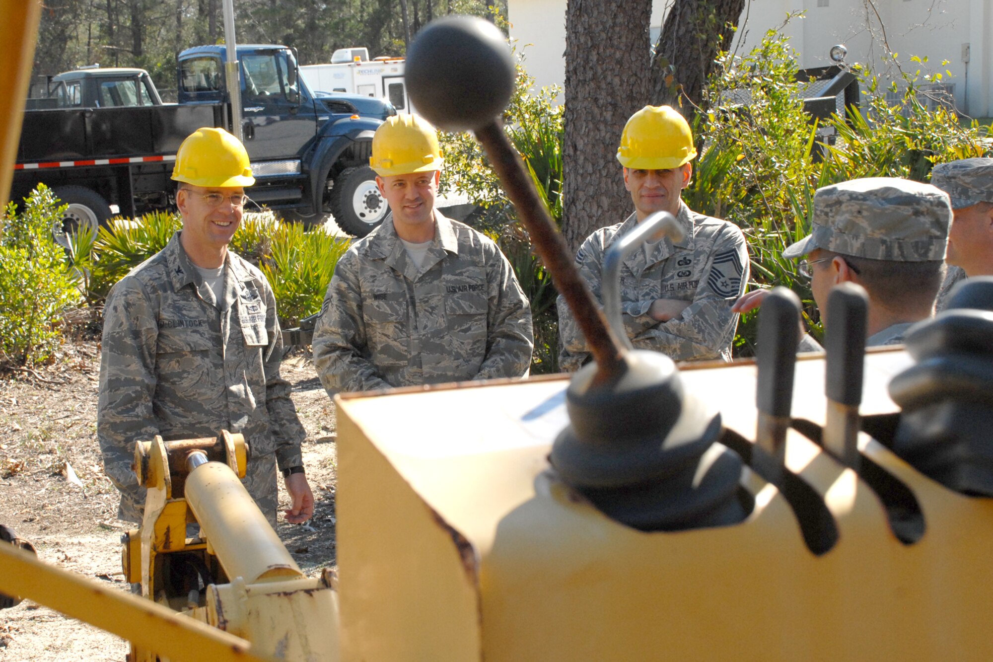 EGLIN AIR FORCE BASE, Fla. -- Col. Bruce McClintock, 96th Air Base Wing commander, signs speaks with Airmen at the 96th Communication Squadron during a weekly walkabout Jan. 30. Airmen in the communications squadron install, maintain and repair cable and antenna services for all users across Eglin's 724 square miles. They also maintain $15M Local Area Network systems and tests completed LAN installations for compliance. Colonel McClintock and Chief Master Sgt. Troy Engholm, 96th ABW command chief master sergeant, take a weekly walkabout visit to the units on base to applaud their successes and determine their needs for mission accomplishment. (U.S. Air Force photo by Staff Sgt. Mike Meares)