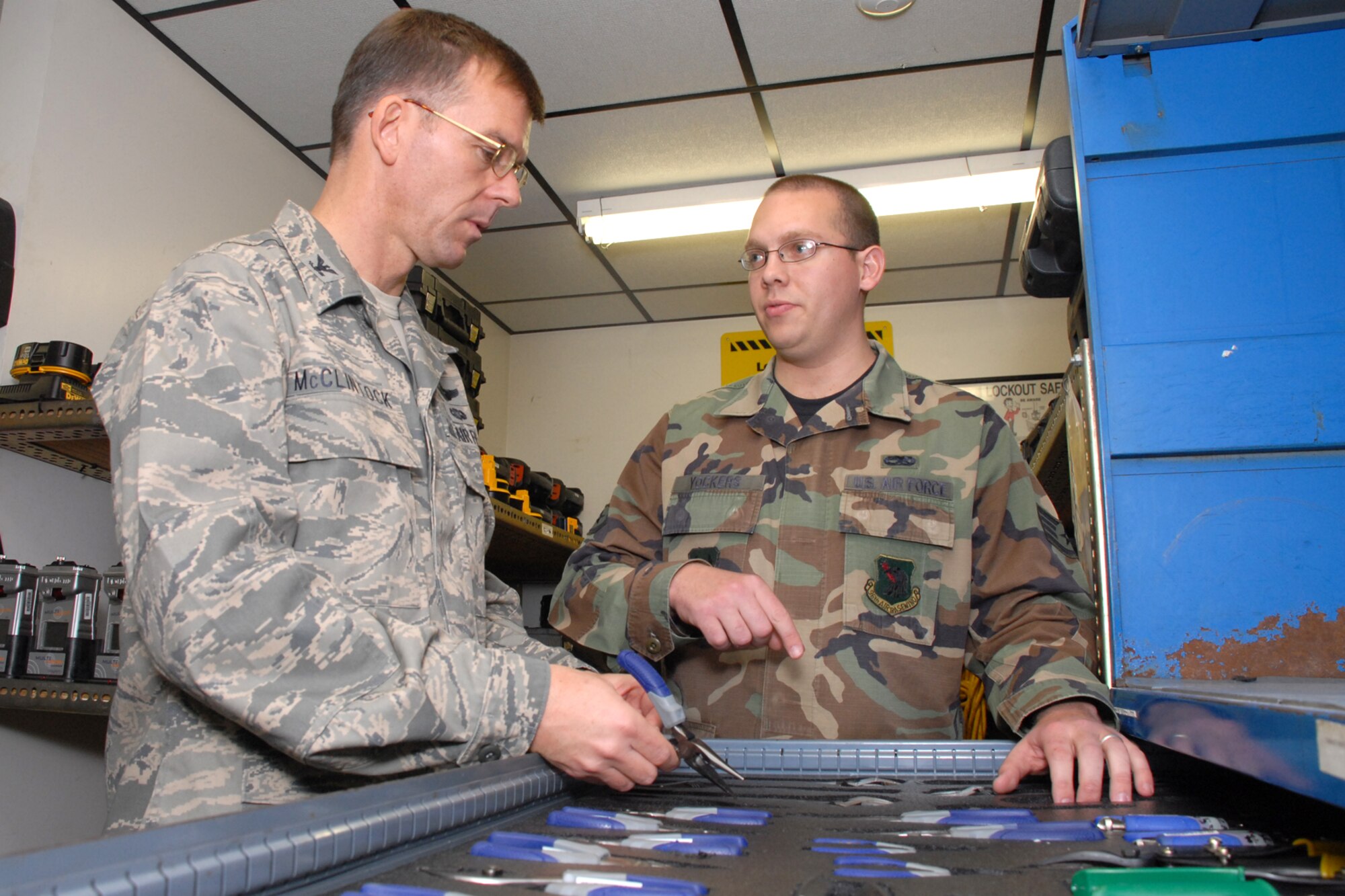 EGLIN AIR FORCE BASE, Fla. -- Col. Bruce McClintock, 96th Air Base Wing commander, is shown the tool accountability process by Staff Sgt. Nathan Yockers, 96th Communication Squadron cable and antenna systems, during a weekly walkabout Jan. 30. Airmen in the communications squadron install, maintain and repair cable and antenna services for all users across Eglin's 724 square miles. They also maintain $15M Local Area Network systems and tests completed LAN installations for compliance. Colonel McClintock and Chief Master Sgt. Troy Engholm, 96th ABW command chief master sergeant, take a weekly walkabout visit to the units on base to applaud their successes and determine their needs for mission accomplishment. (U.S. Air Force photo by Staff Sgt. Mike Meares)