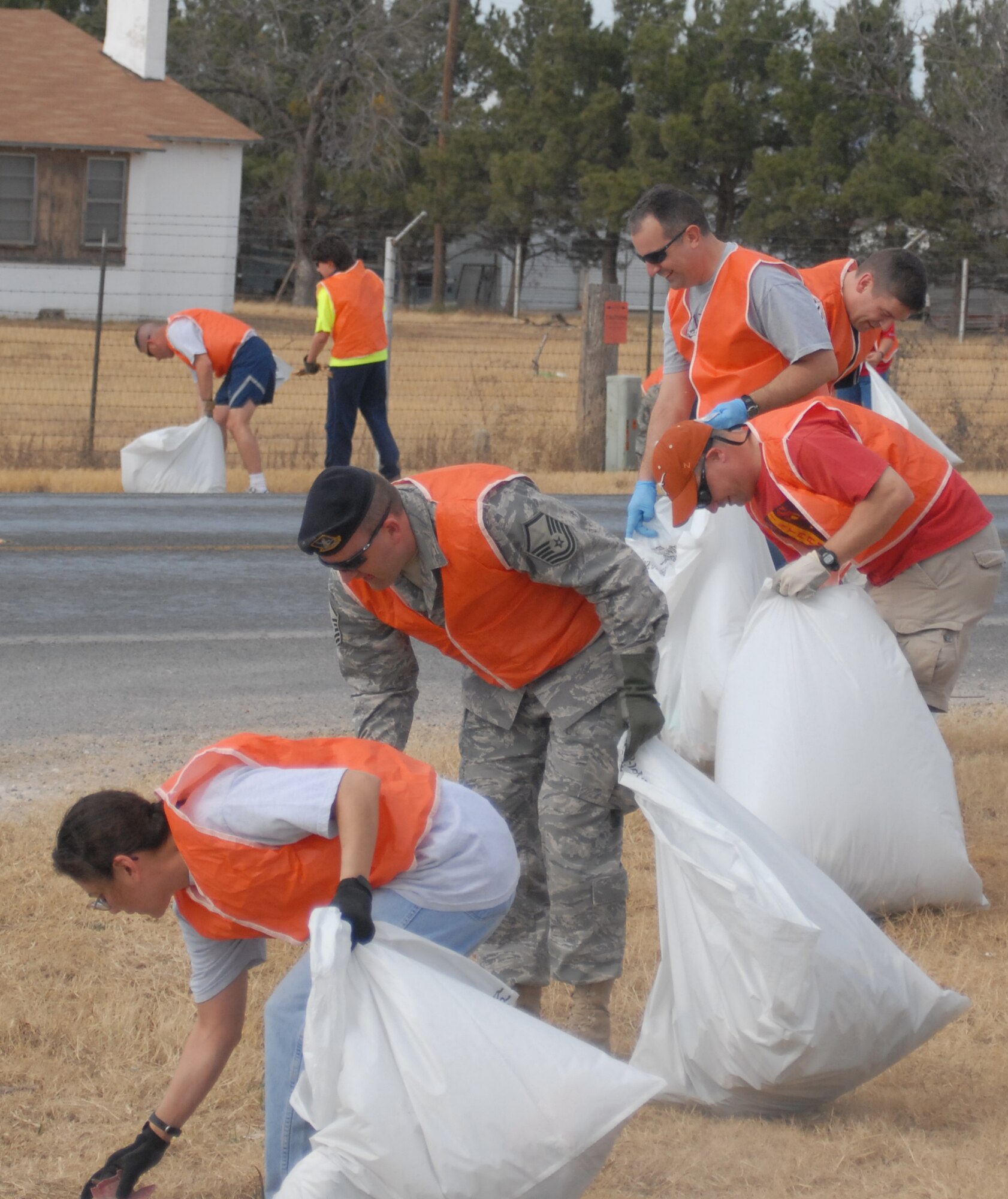 Top 3 organization members clean trash from Christoval Road during the Top 3 Adopt-a-Highway clean-up Jan. 23. (U.S. Air Force photo by Senior Master Sgt. Robert Martinez)