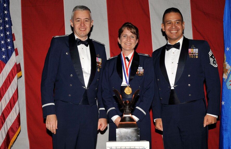 MOODY AIR FORCE BASE, Ga. -- Capt. Kimberly Peters, 23rd Wing Company Grade Officer of the Year Award winner poses for a photo with (left) Col. Kenneth Todorov, 23rd Wing commander and (right) Chief Master Sgt. Paul Burgess, 23rd Wing command chief, during the 2008 Annual Awards Ceremony held at the James H. Rainwater Conference Center Jan. 31. (U.S. Air Force photo by Senior Airman Schelli Jones) 
