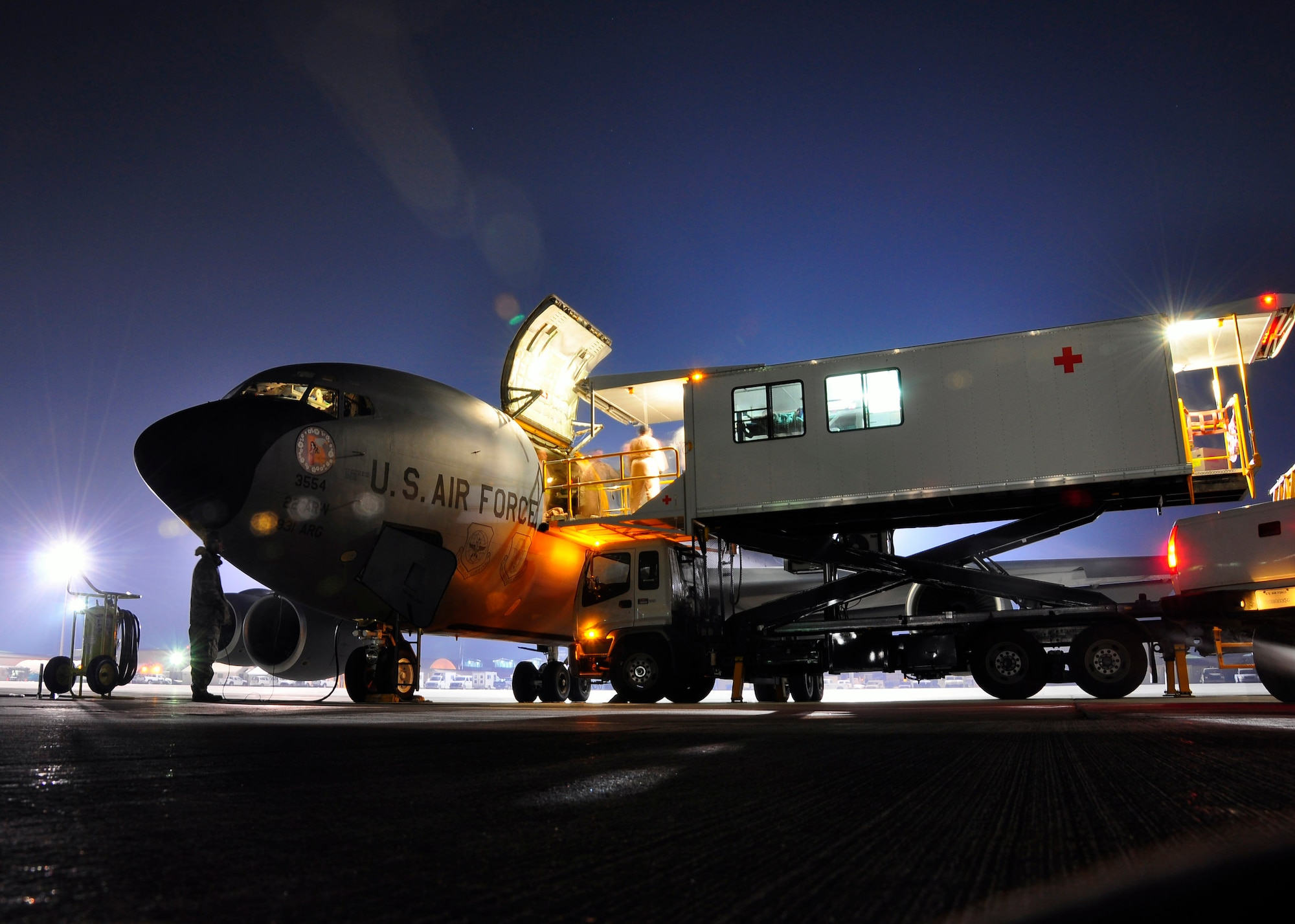 Sick and wounded servicemembers are transferred onto a KC-135 Stratotanker at Bagram Air Field, Afghanistan. Members of the 931st Air Refueling Group from McConnell Air Force Base, Kan.,  volunteered for the 12-day aeromedical evacuation mission. (Courtesy photo/Lt. Col. Tyoshi Tung)